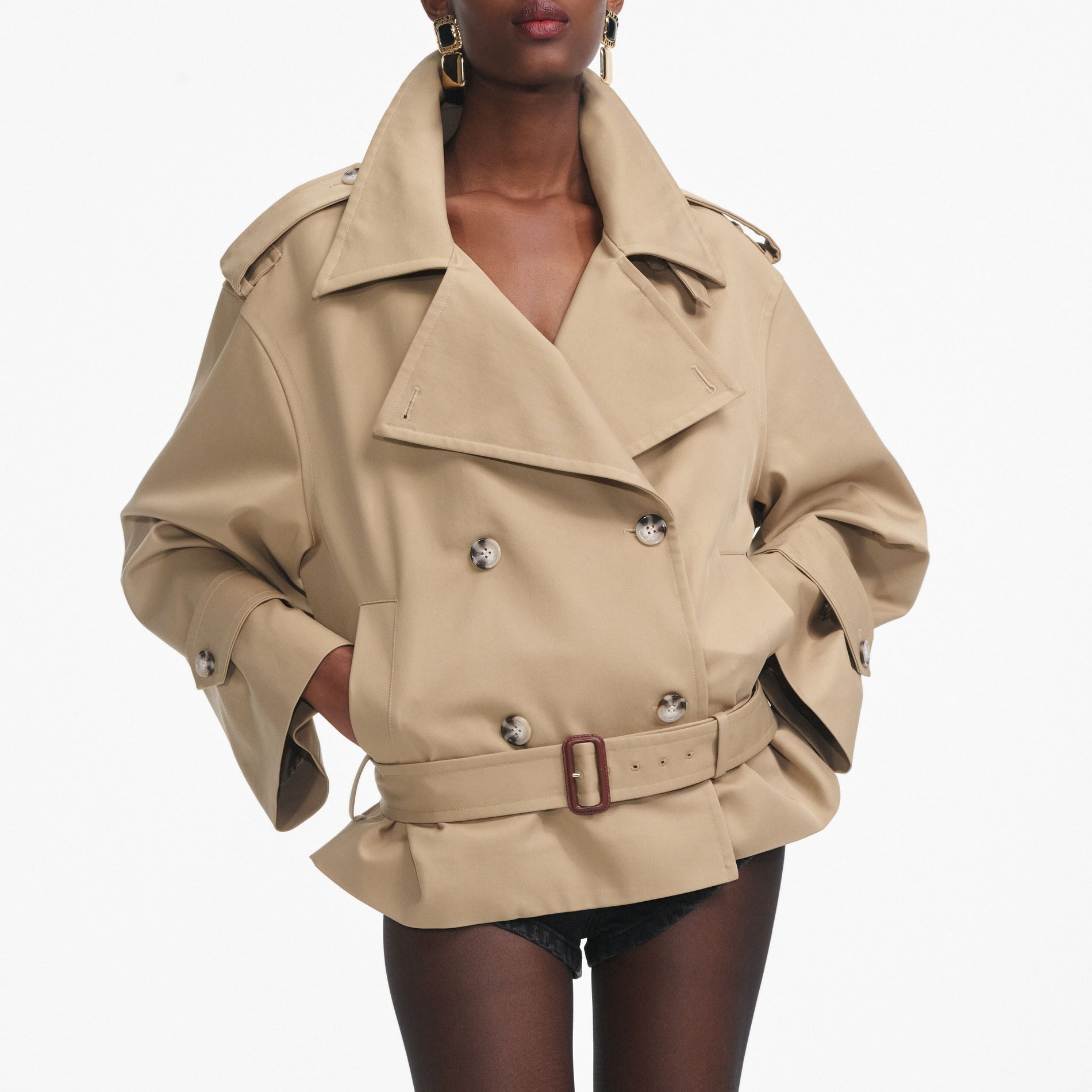 A close up of a woman wearing the Beige Trench Jacket