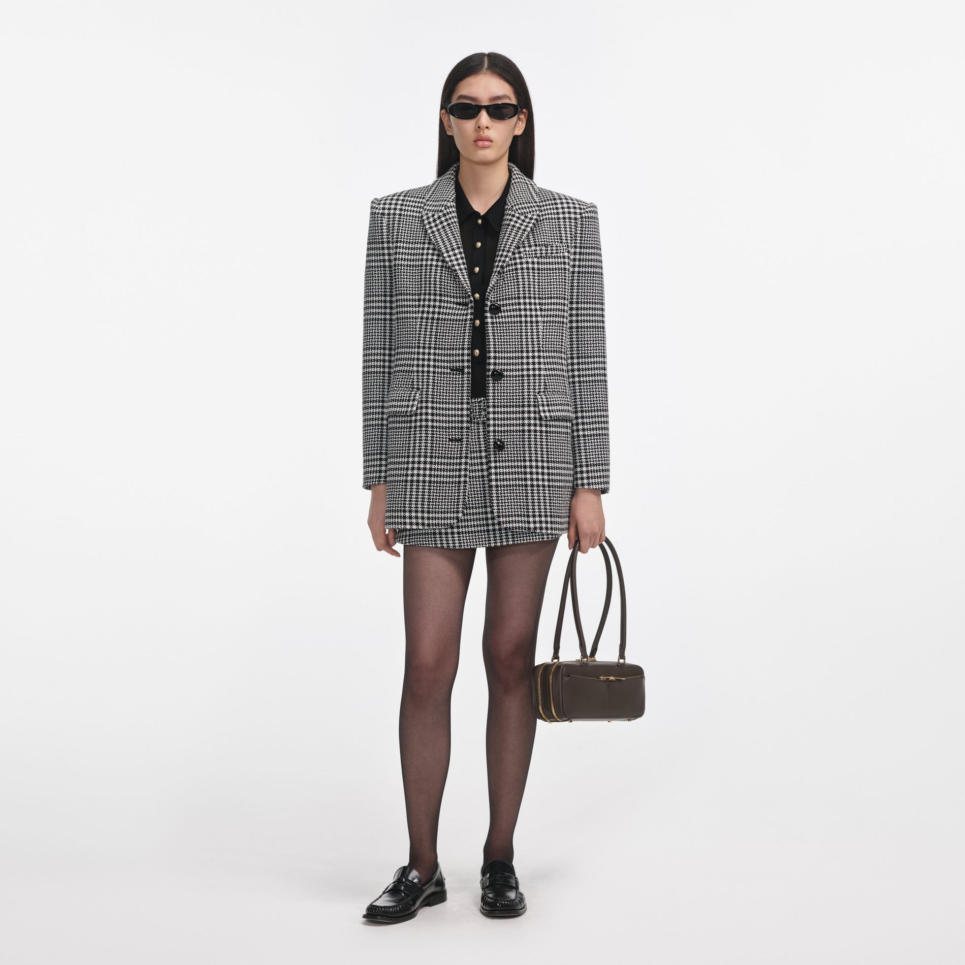 Front view of a woman wearing the Houndstooth Blazer