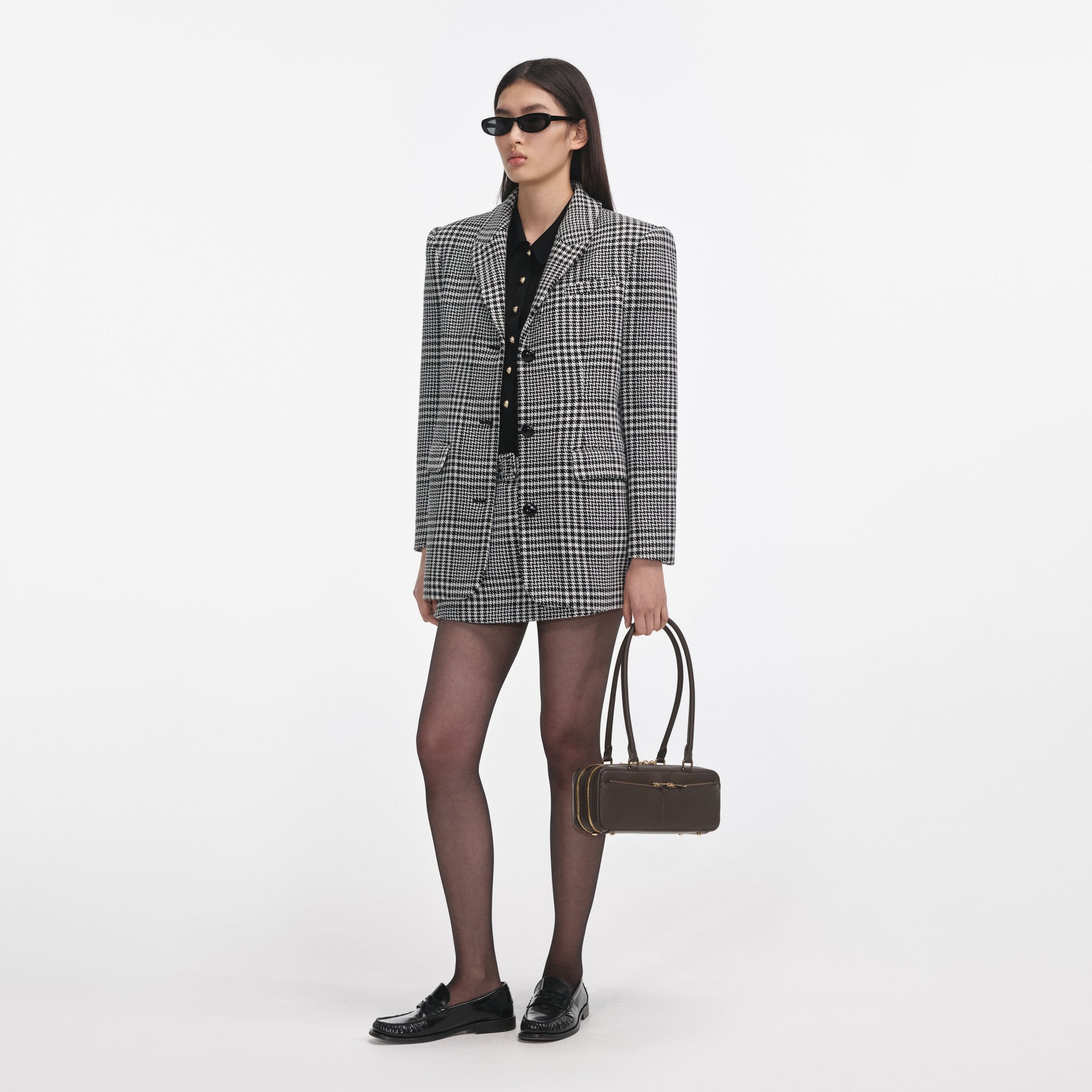 Side view of a woman wearing the Houndstooth Blazer