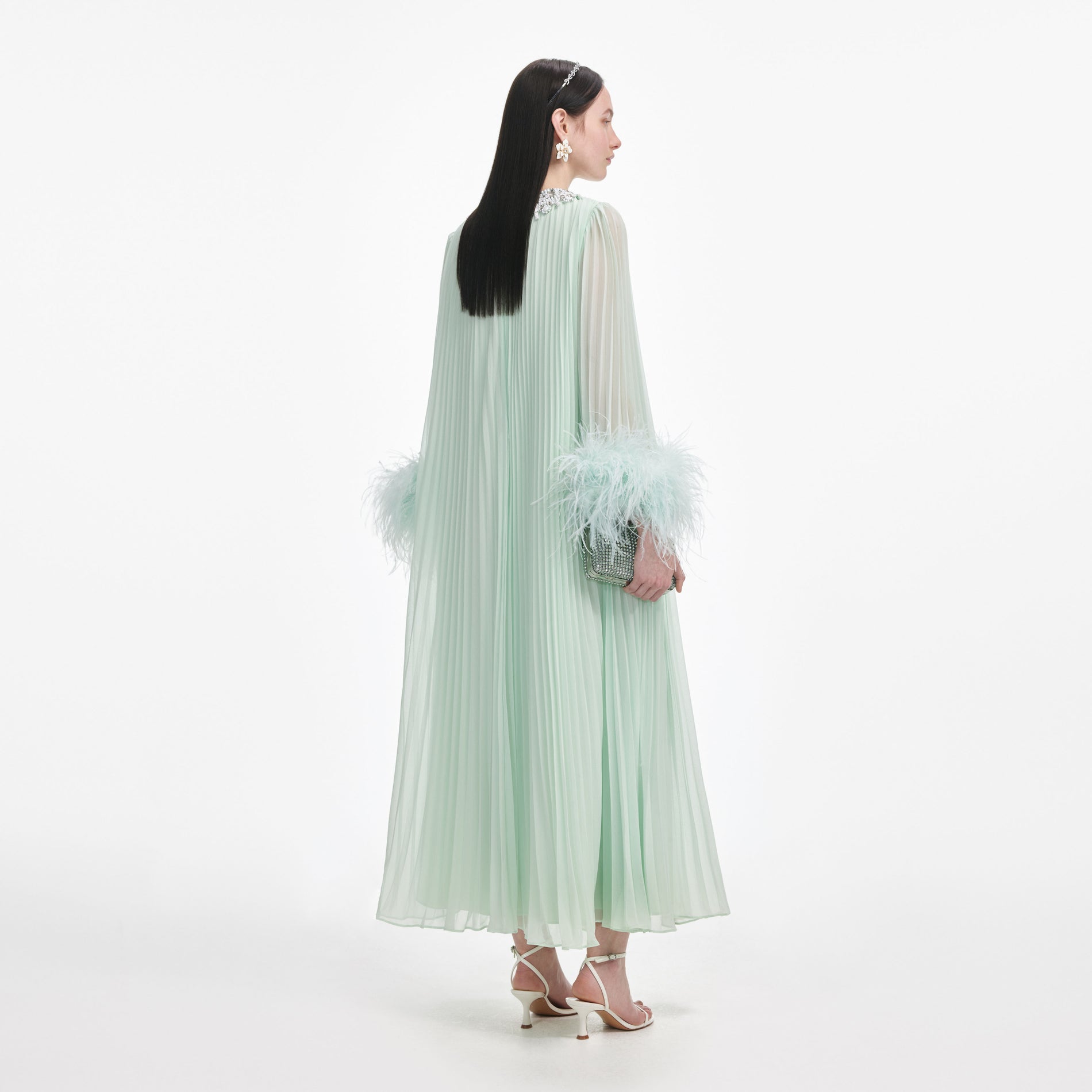Back view of a woman wearing the Mint Chiffon Feather Midi Dress