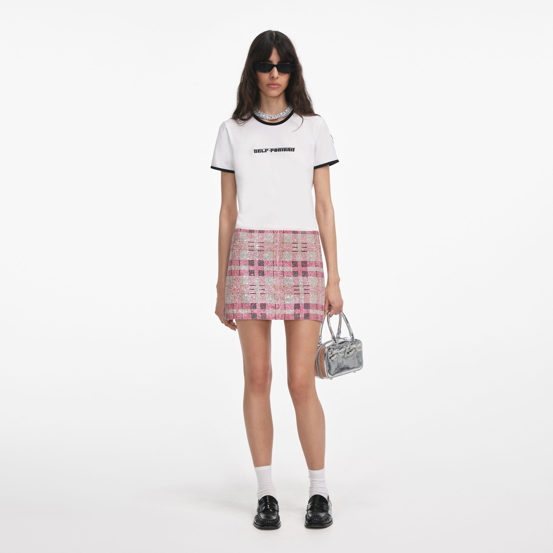 Front view of a woman wearing the White T-Shirt With Embroidered Logo