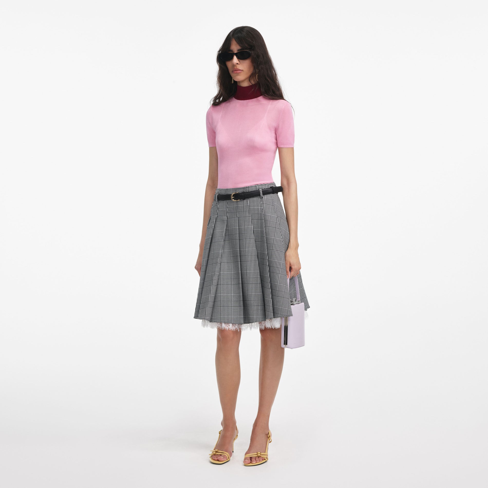 Side view of a woman wearing the Pink Viscose Knit Short Sleeve Top