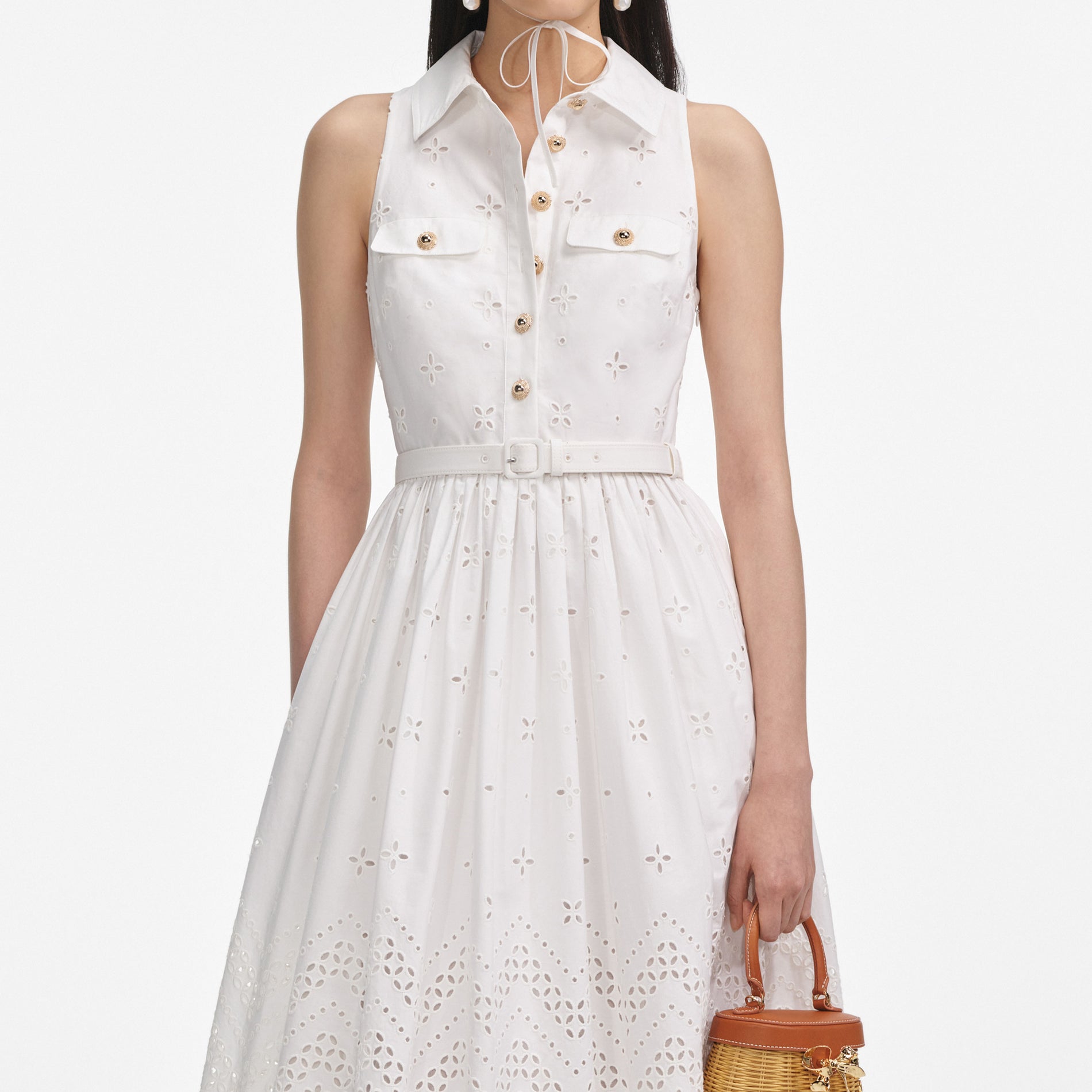 A close up of a woman wearing the White Cotton Broderie Collared Midi Dress