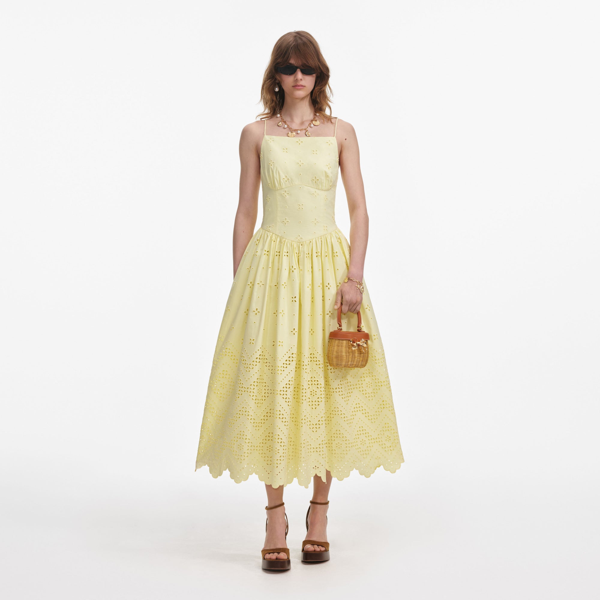 Front view of a woman wearing the Yellow Cotton Broderie Midi Dress