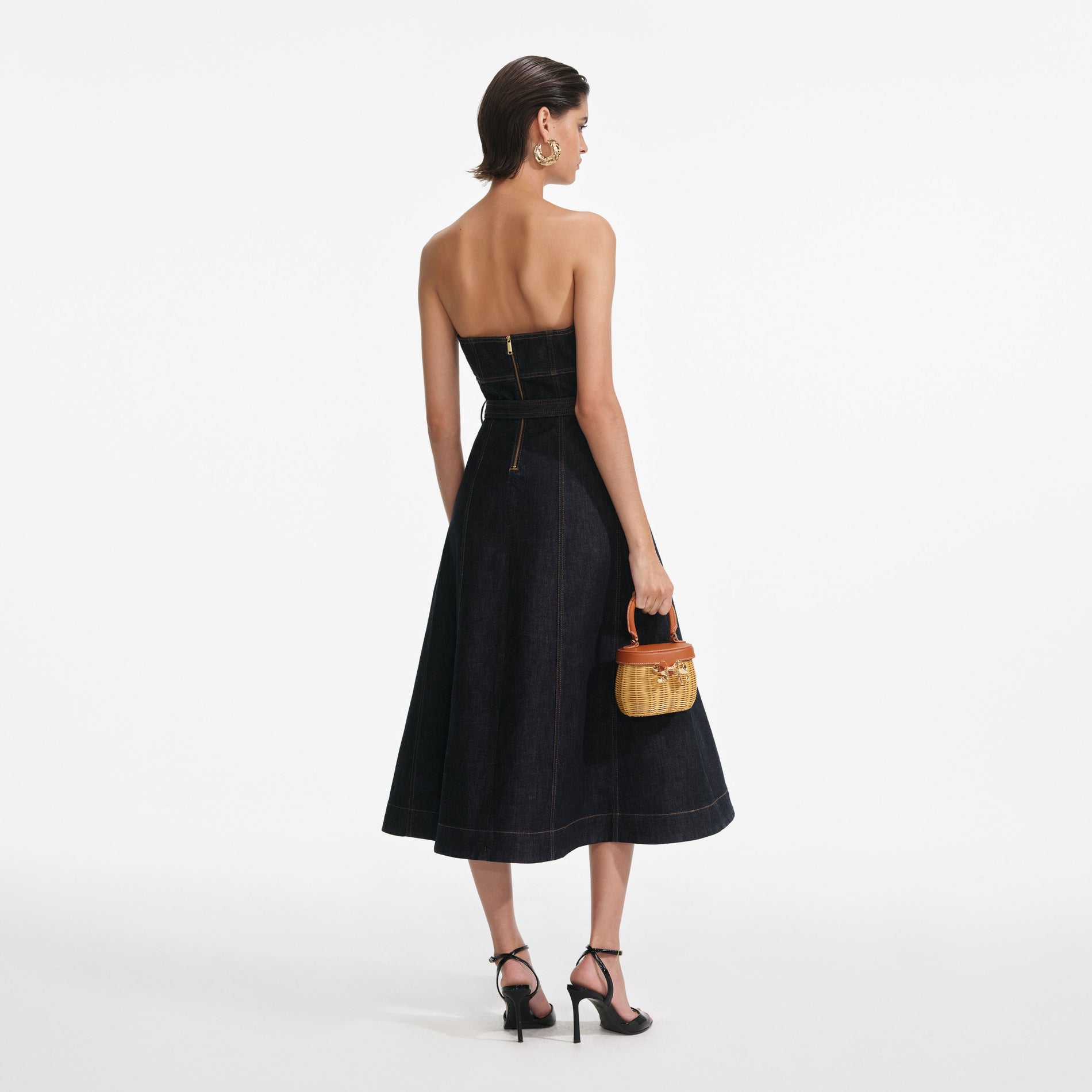 Back view of a woman wearing the Indigo Denim Bandeau Midi Dress