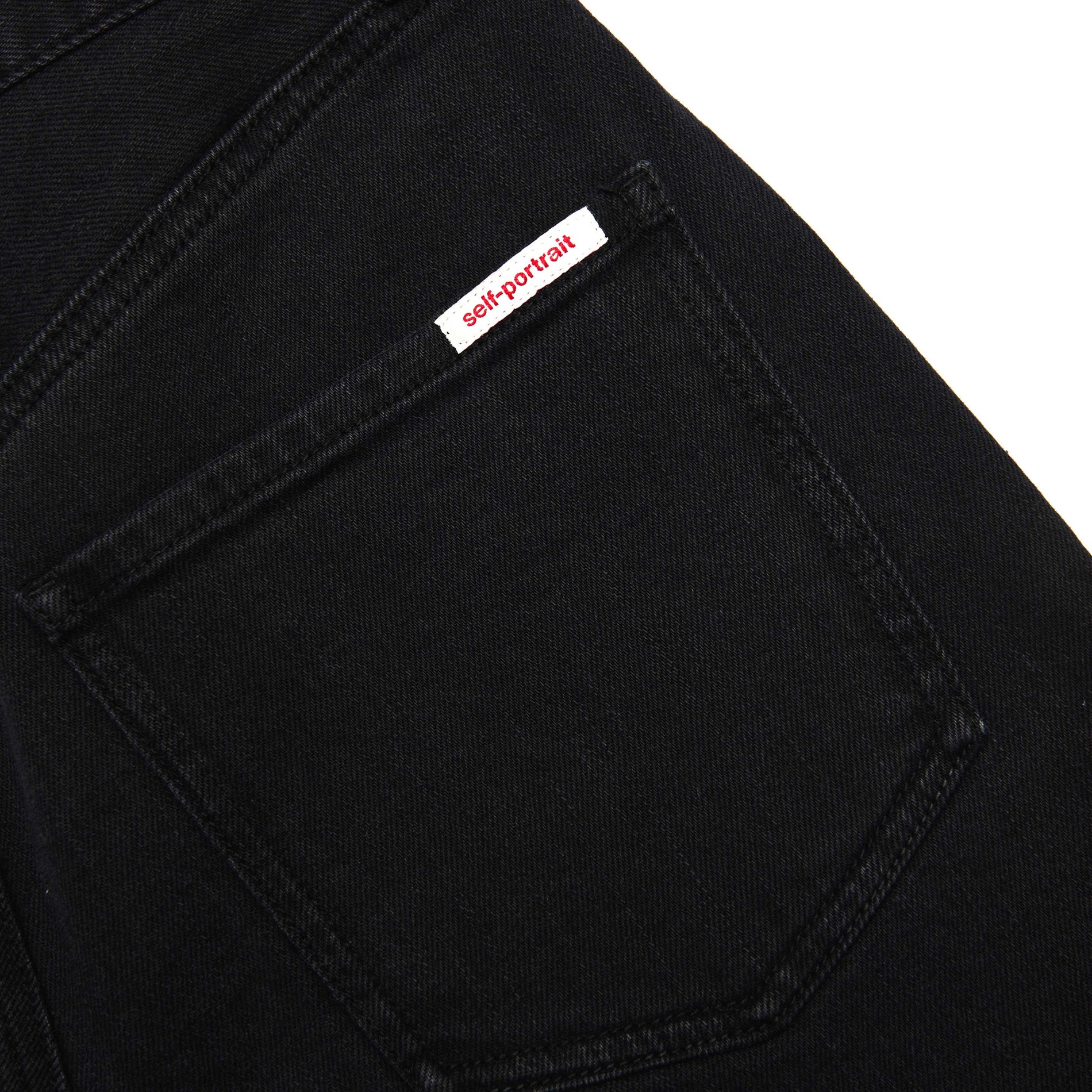 A close up of the fabric for the Black Barrel Leg Jeans