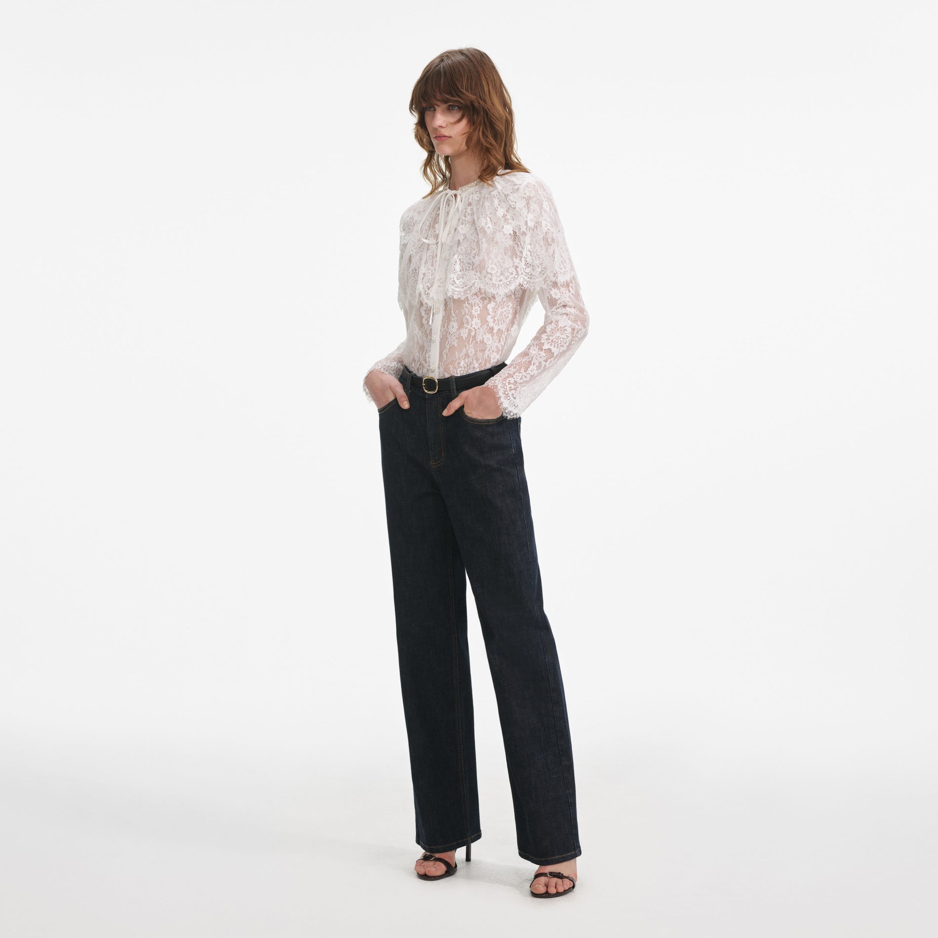 Side view of a woman wearing the Indigo Straight Leg Jeans