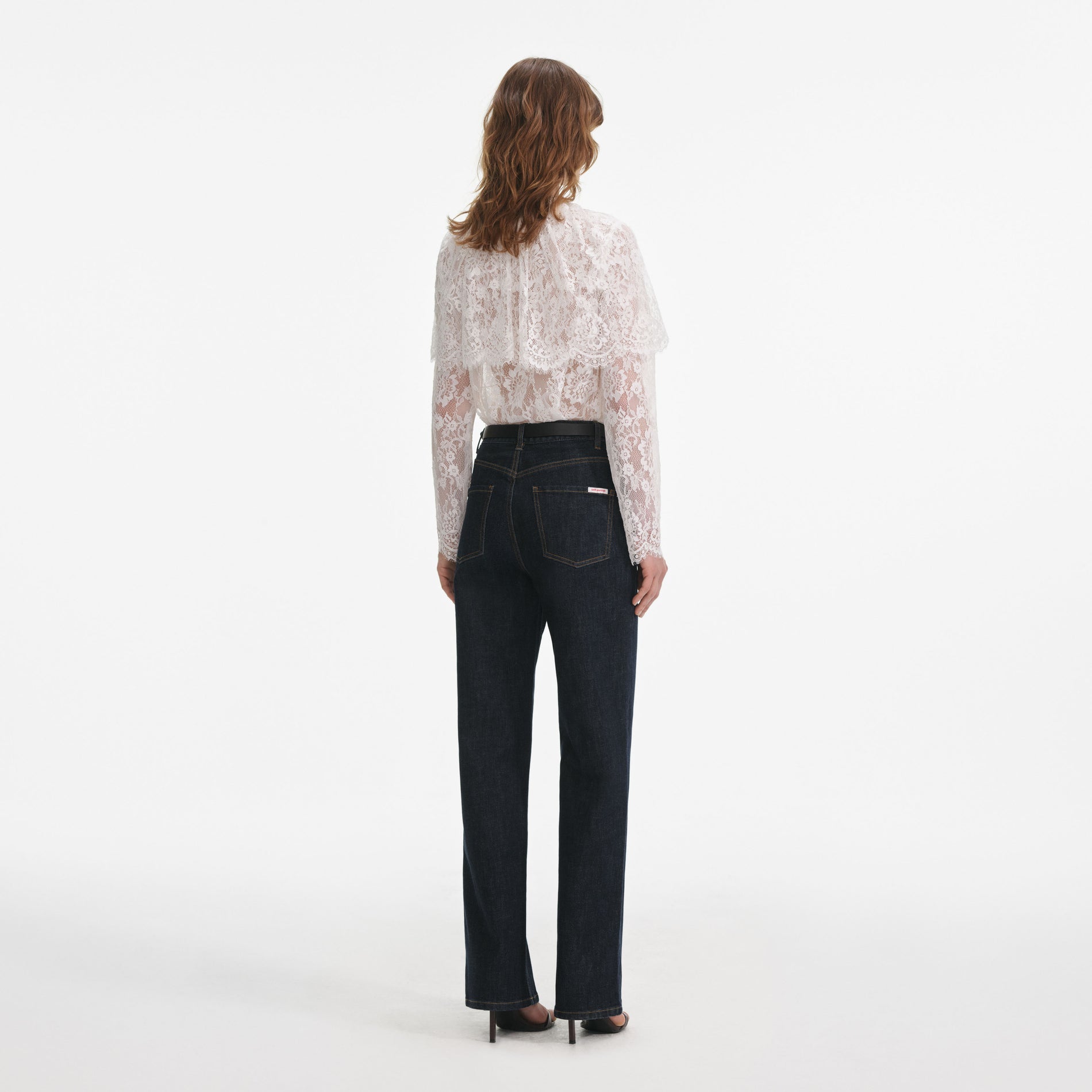 Back view of a woman wearing the Indigo Straight Leg Jeans