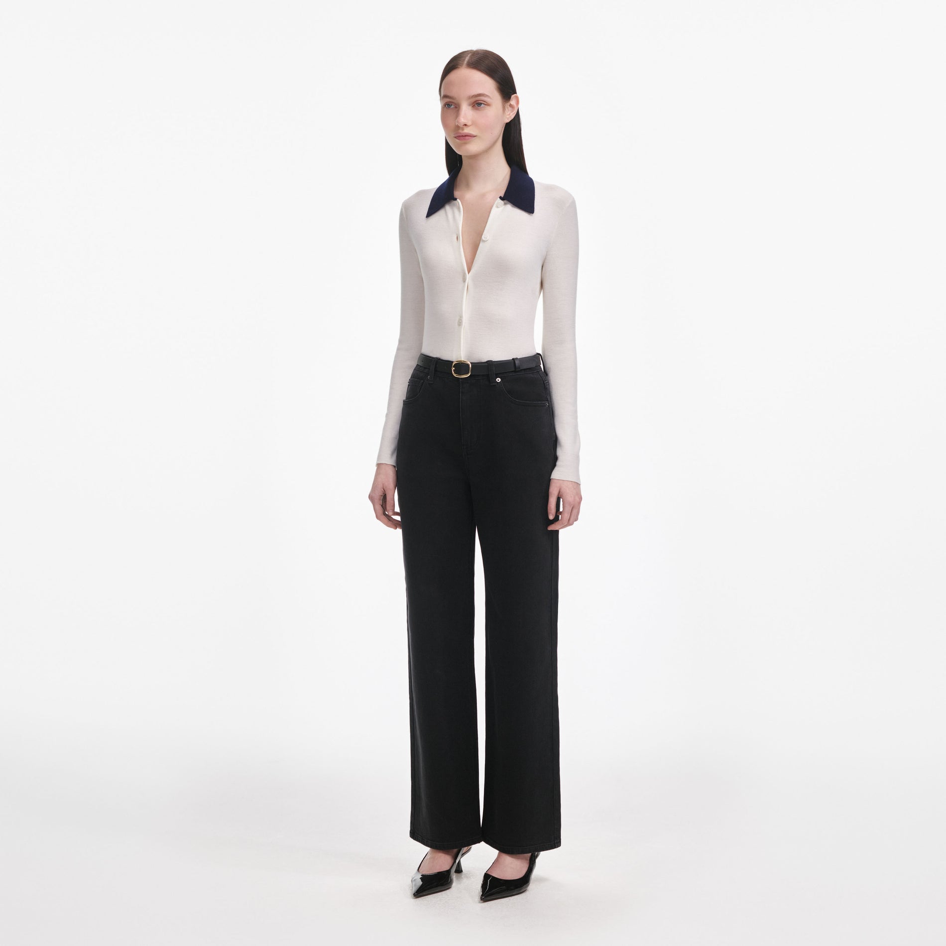 Side view of a woman wearing the Black Straight Leg Jeans