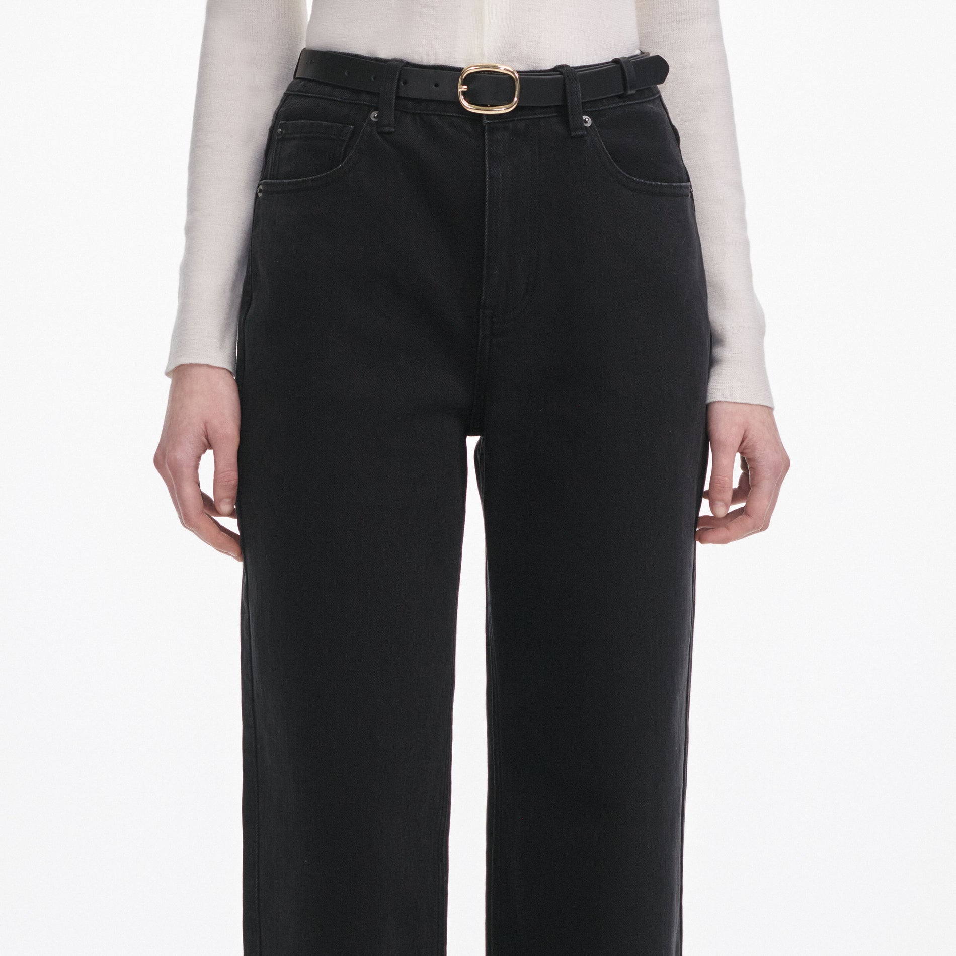 A close up of a woman wearing the Black Straight Leg Jeans