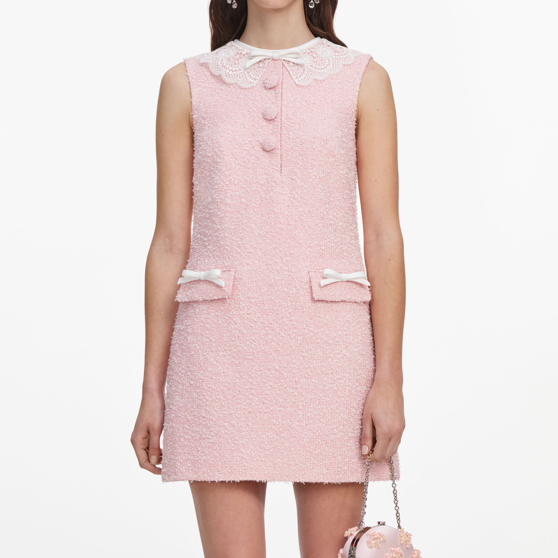 A close up of a woman wearing the Pink Boucle Lace Collar Mini Dress