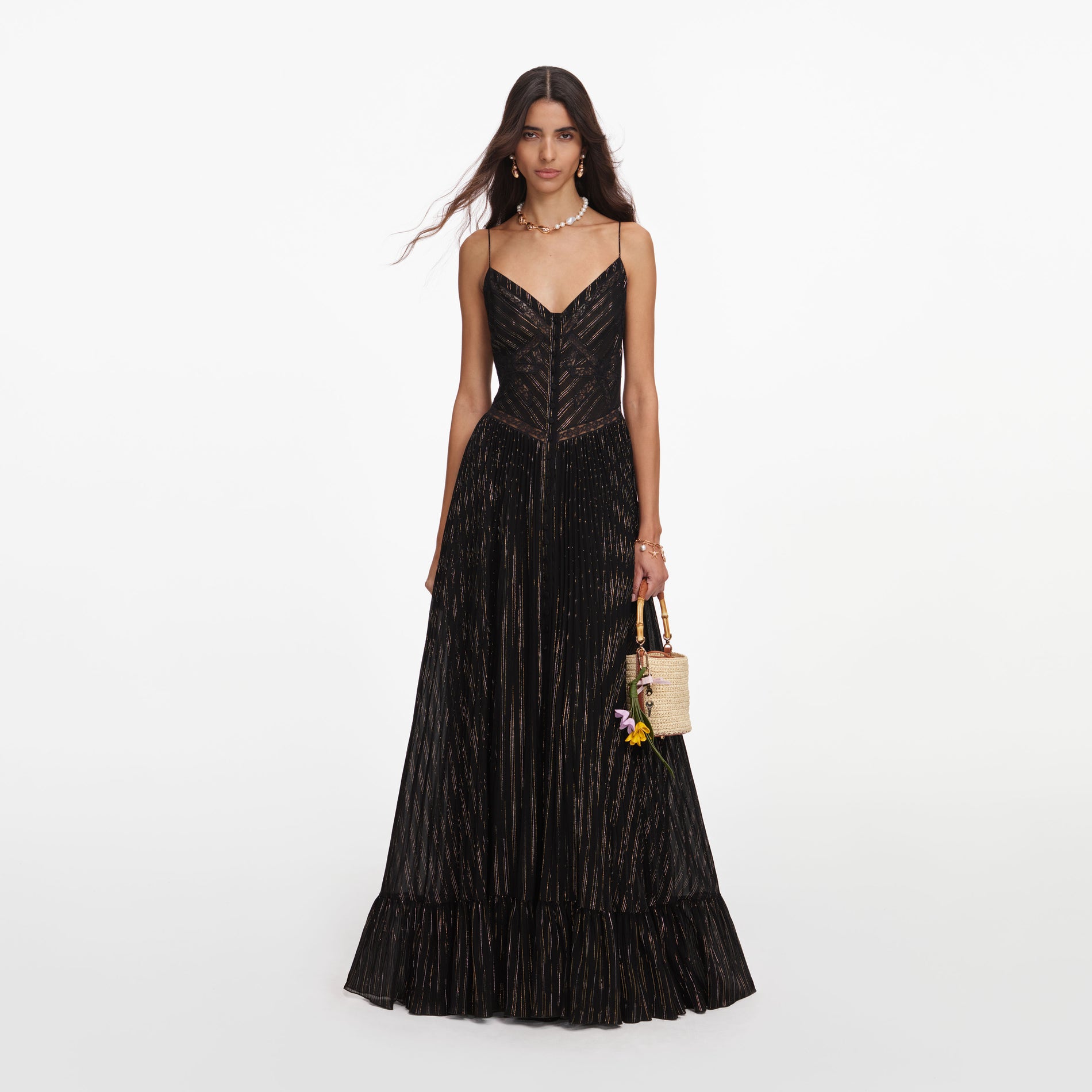 Front view of a woman wearing the Black Lurex Stripe Pleated Maxi Dress