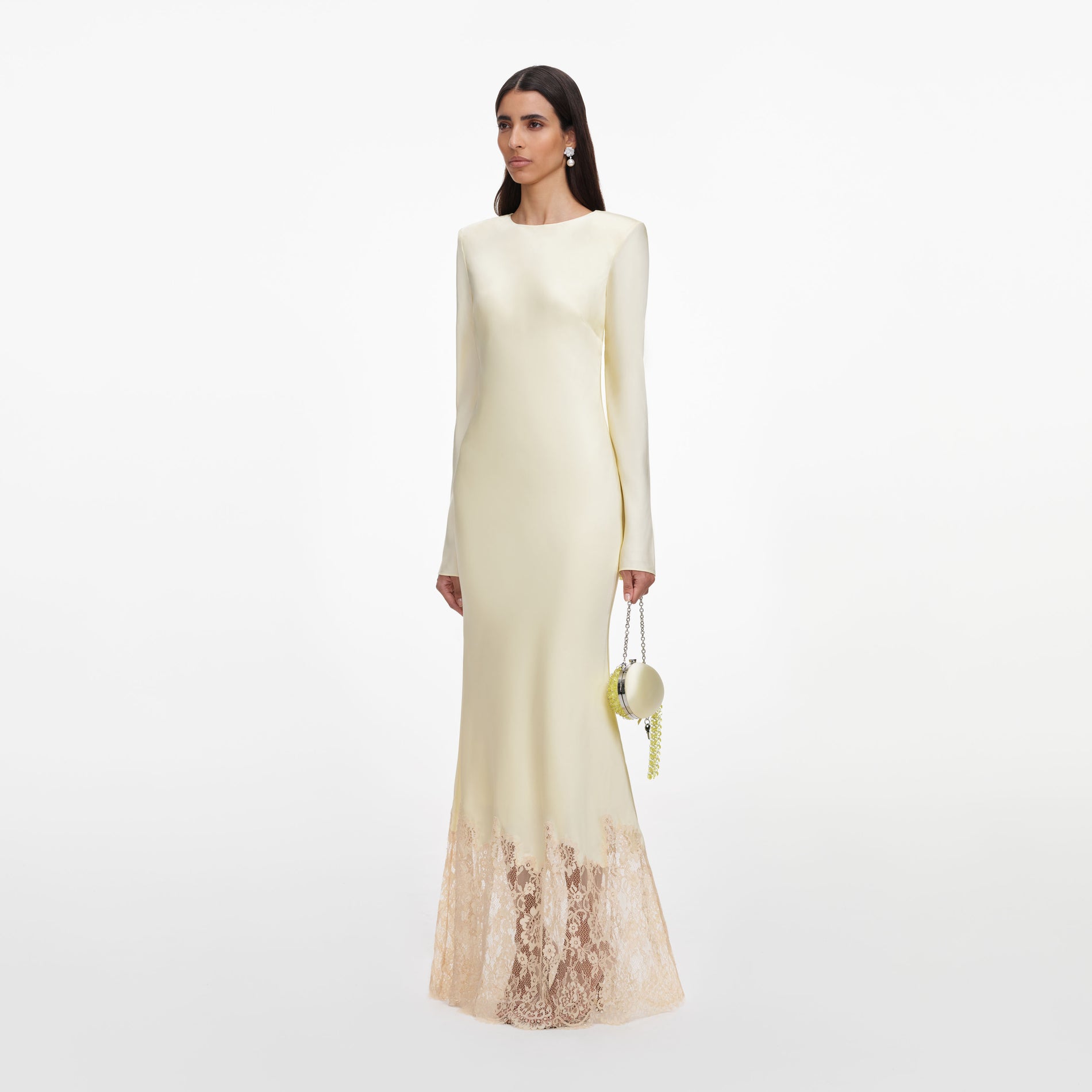 Side view of a woman wearing the Yellow Viscose Lace Maxi Dress