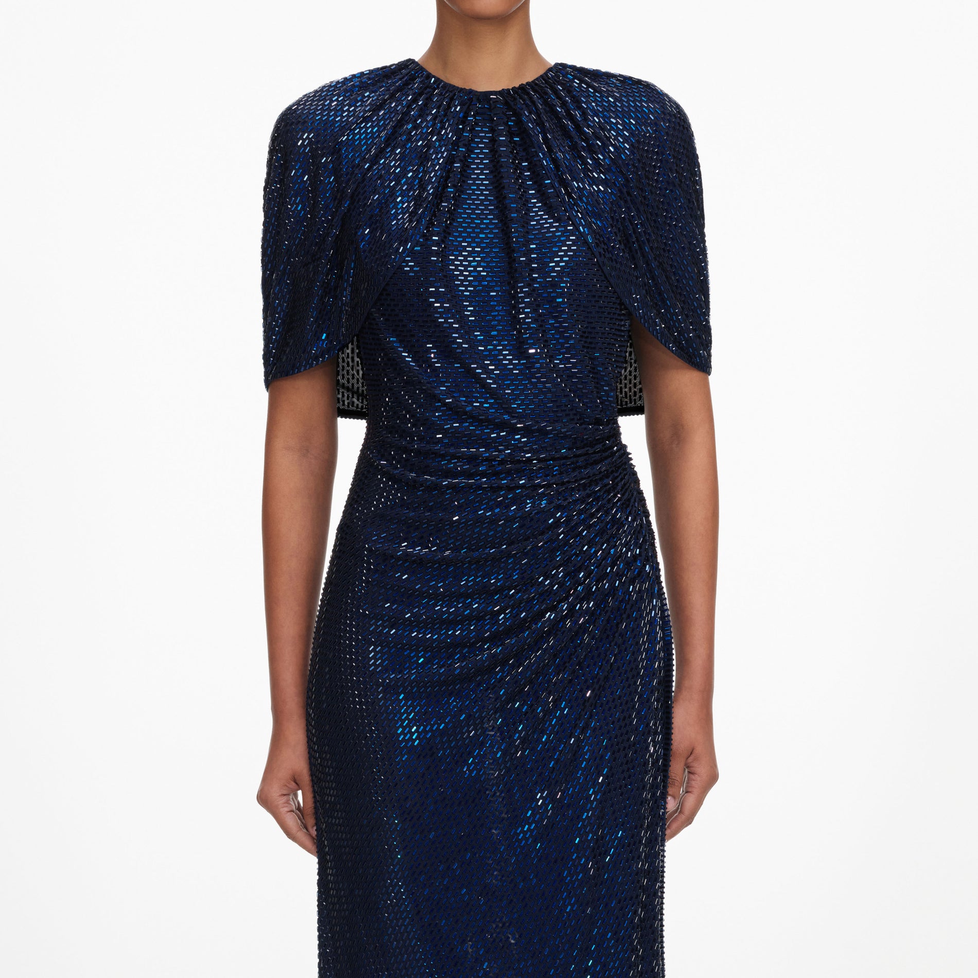A close up of a woman wearing the Navy Rhinestone Cape Sleeve Midi Dress
