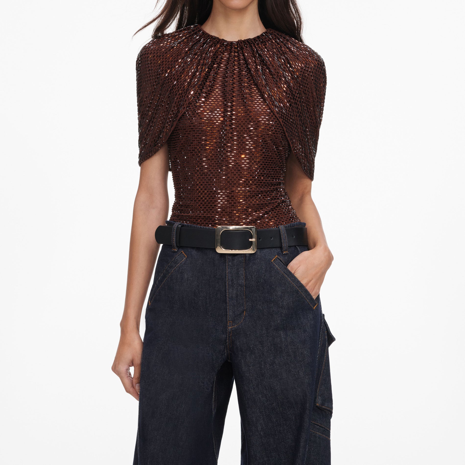 A close up of a woman wearing the Brown Rhinestone Cape Sleeve Top