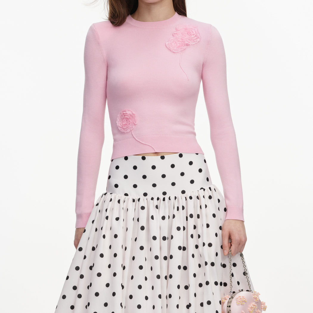 A close up of a woman wearing the Cream Polka Dot Taffeta Midi Skirt