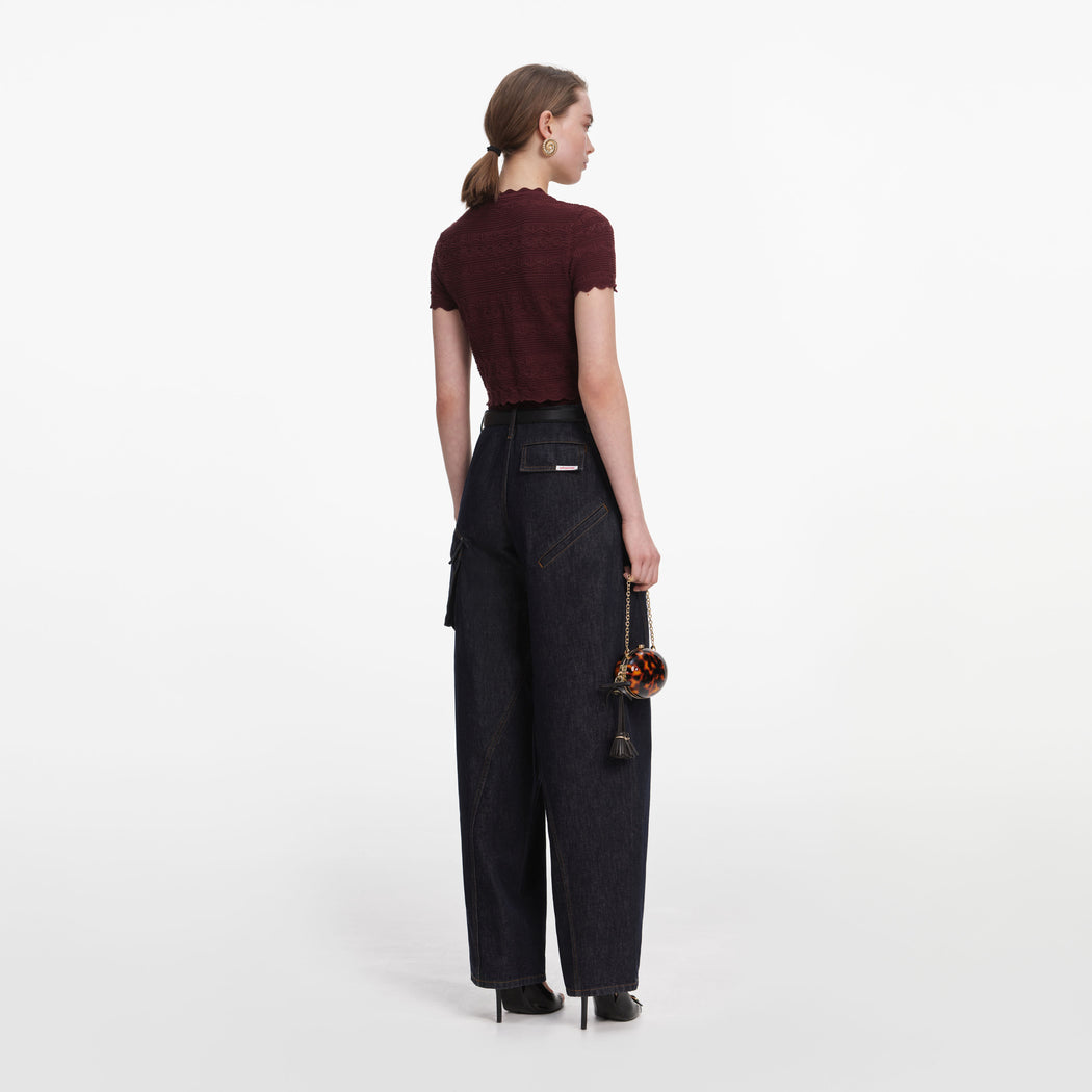 Back view of a woman wearing the Brown Pointelle Knit Top