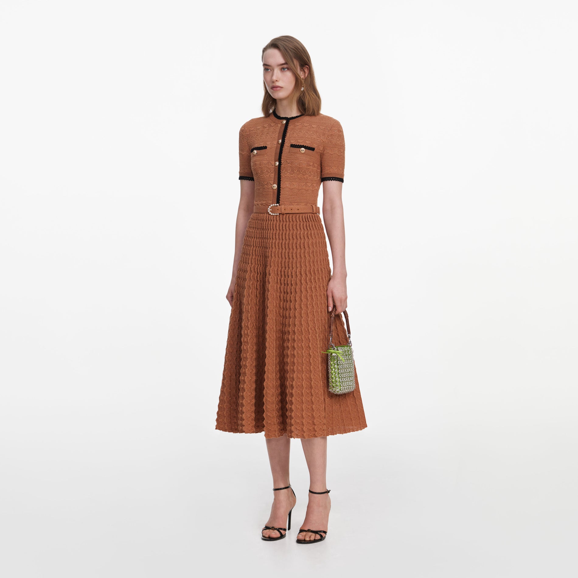Side view of a woman wearing the Brown Pointelle Knit Midi Dress