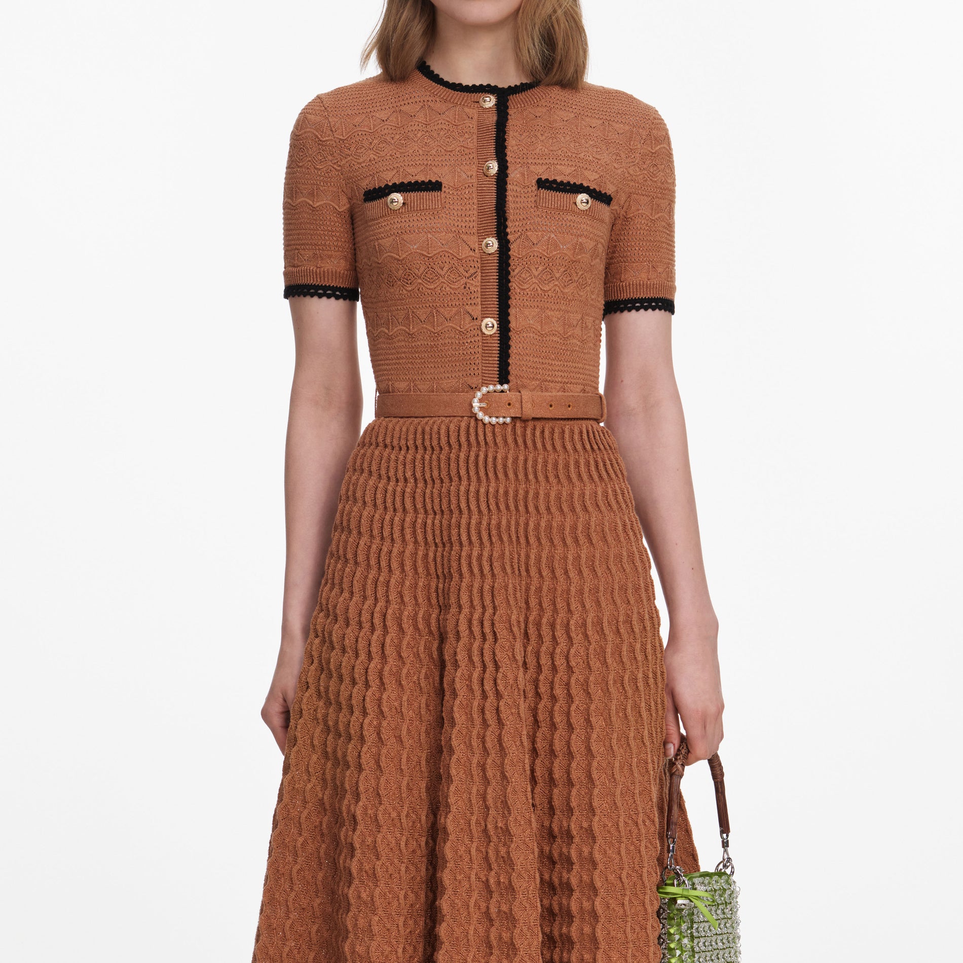 A close up of a woman wearing the Brown Pointelle Knit Midi Dress
