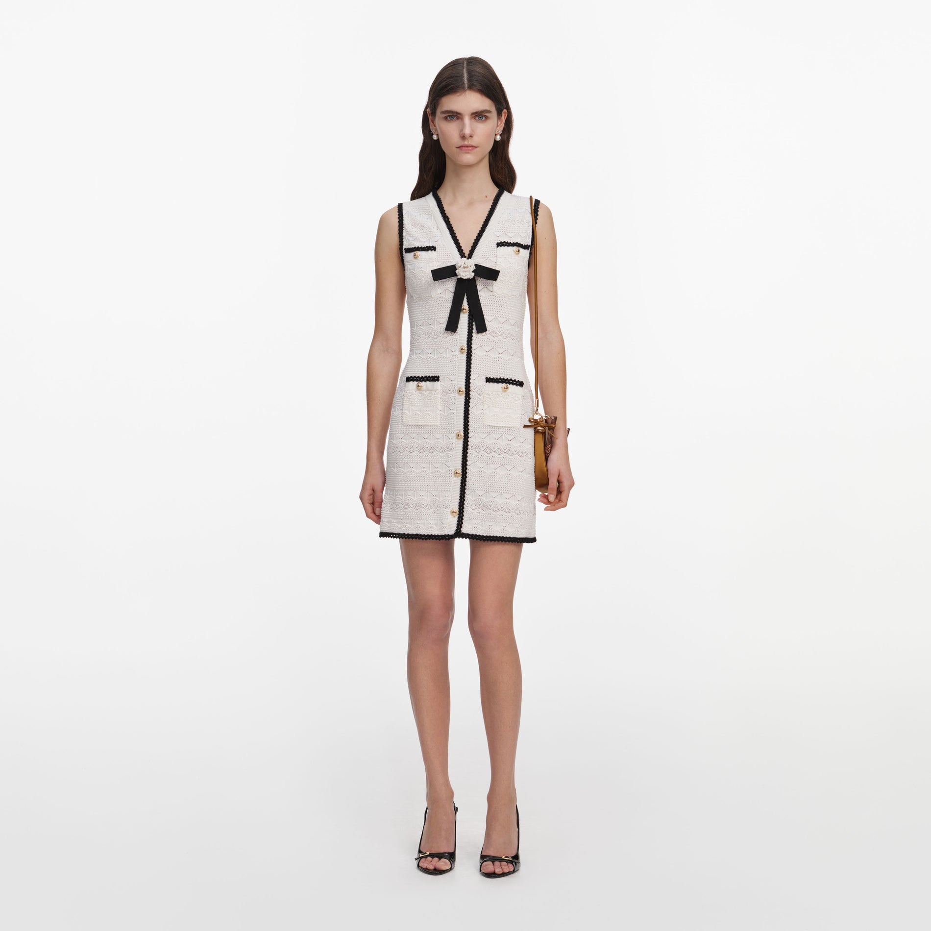 Front view of a woman wearing the White Pointelle Knit Mini Dress