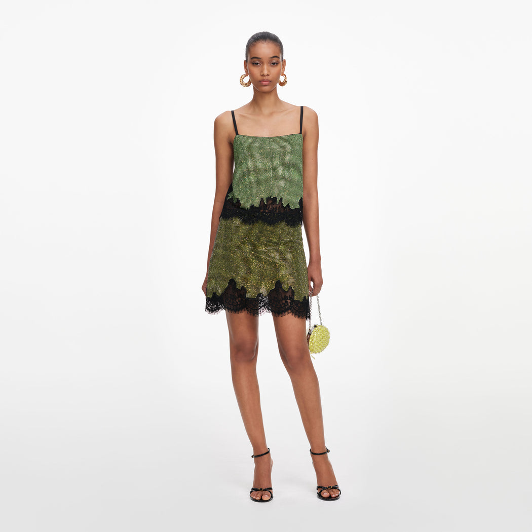 Front view of a woman wearing the Green Crystal Chainmail Top