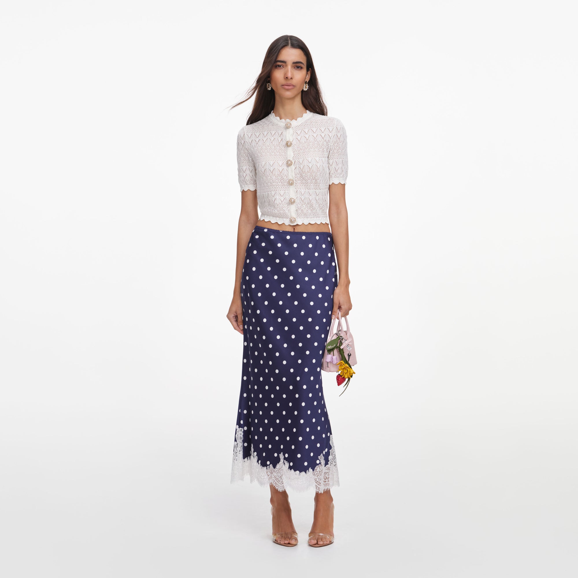 Front view of a woman wearing the White Pointelle Knit Top