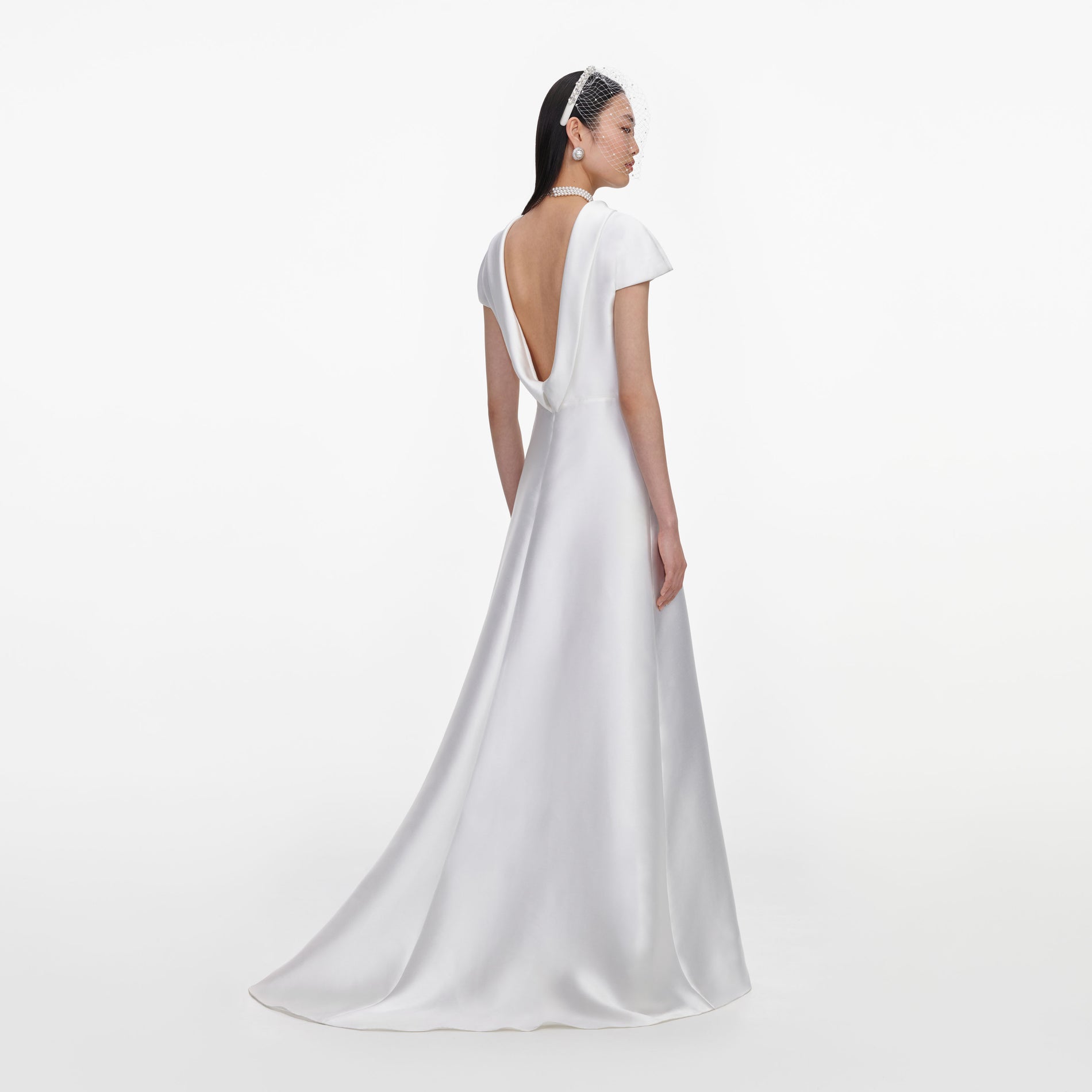 Back view of a woman wearing the White Taffeta Collared Maxi Dress