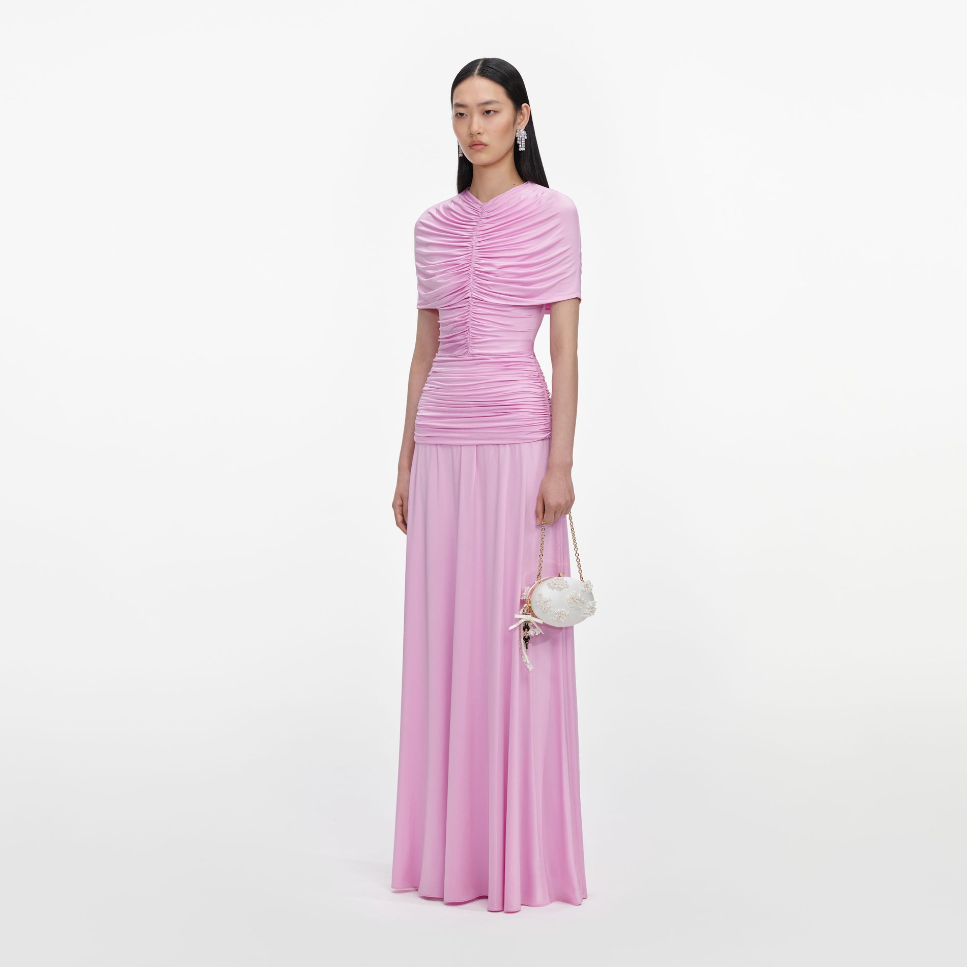 Side view of a woman wearing the Pink Jersey Gathered Maxi Dress