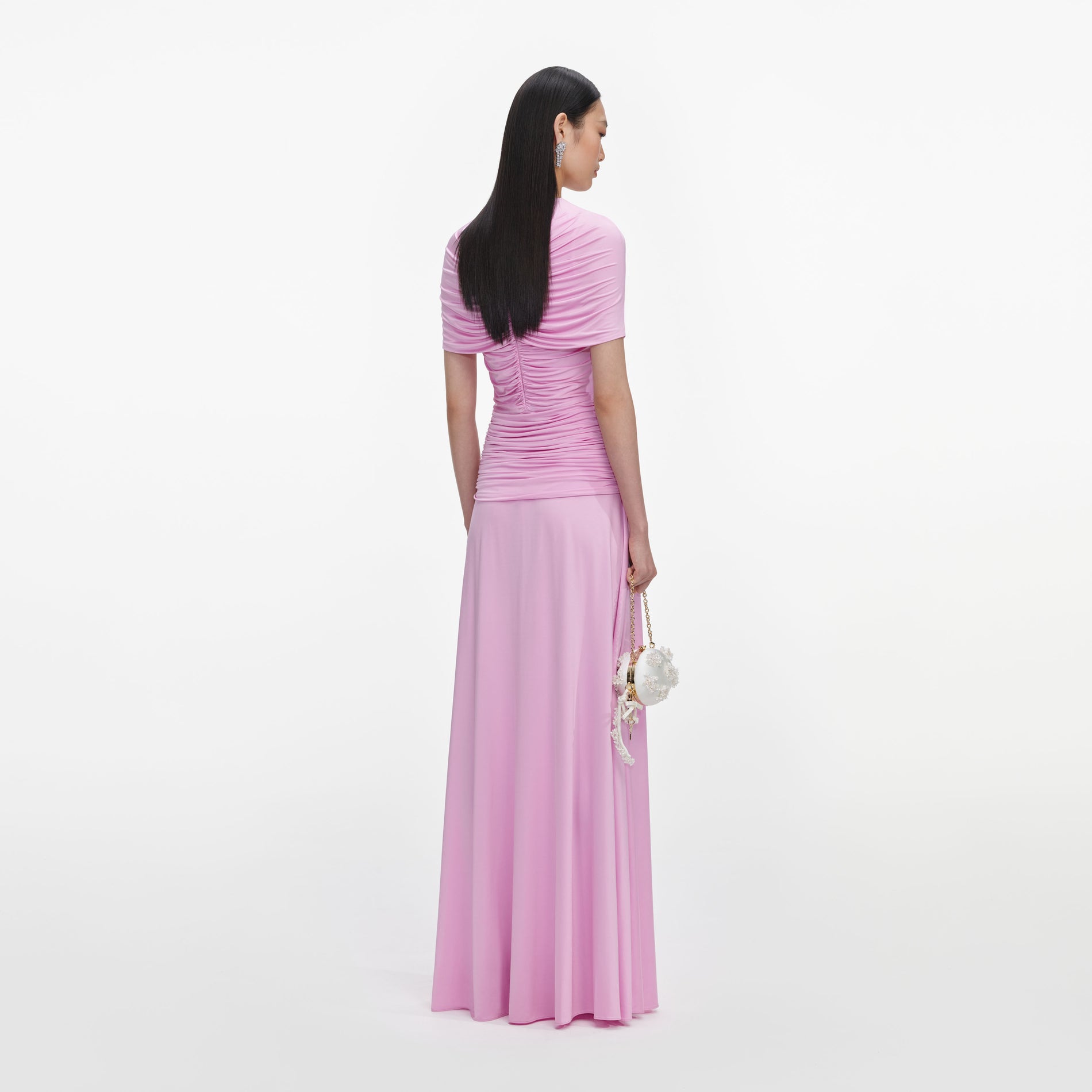 Back view of a woman wearing the Pink Jersey Gathered Maxi Dress