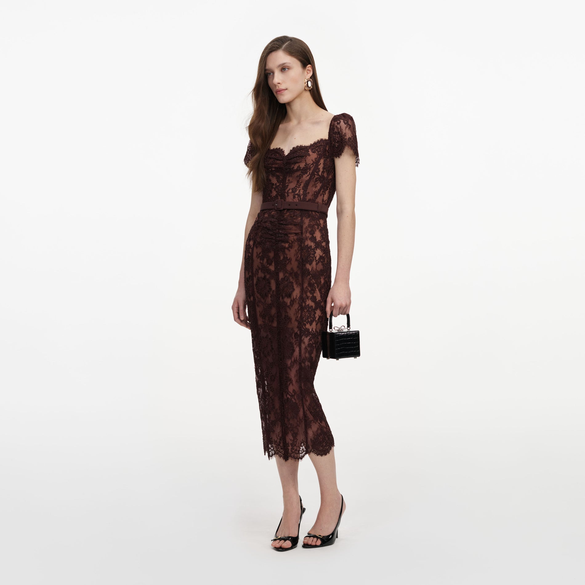 Side view of a woman wearing the Brown Floral Lace Midi Dress