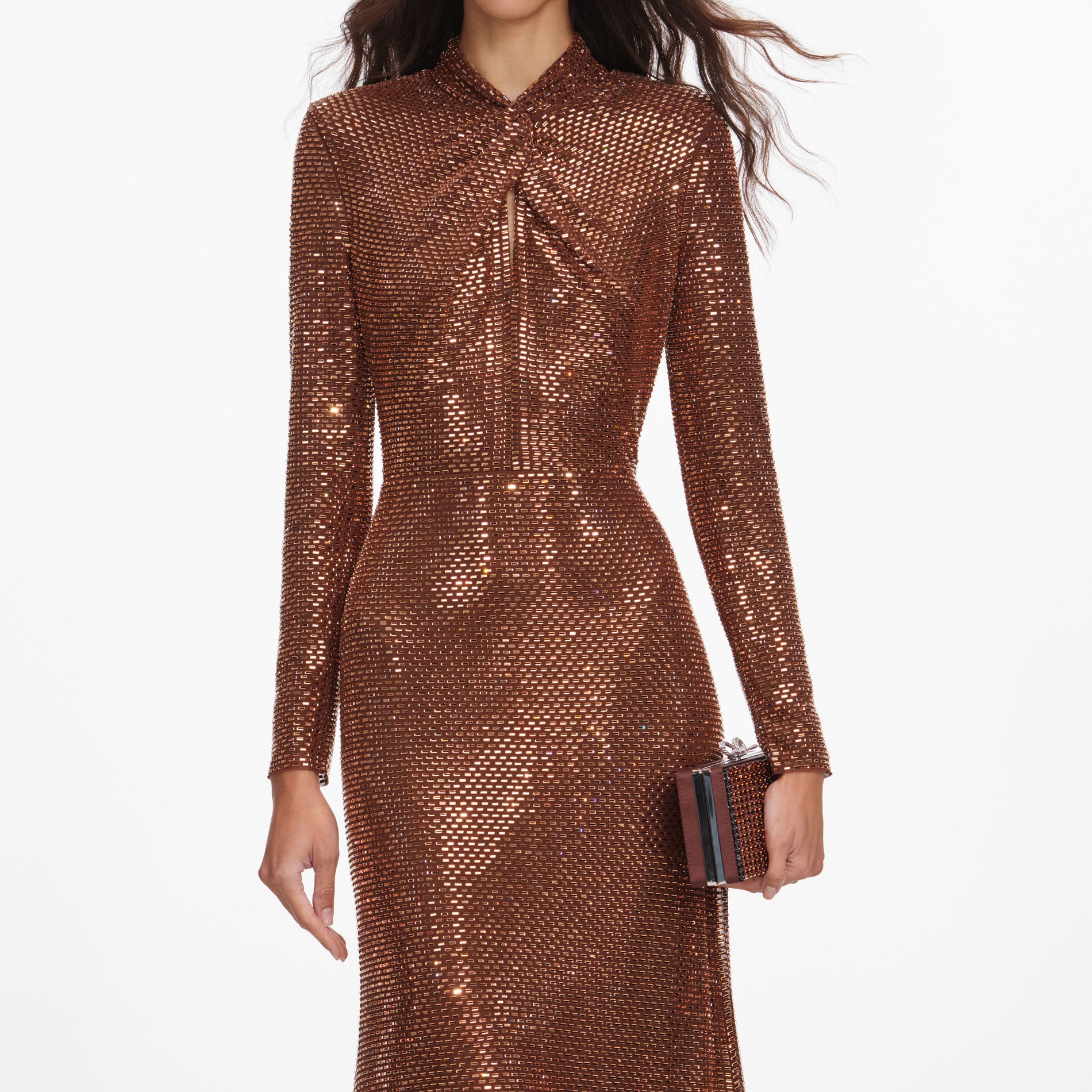 A close up of a woman wearing the Bronze Rhinestone Midi Dress