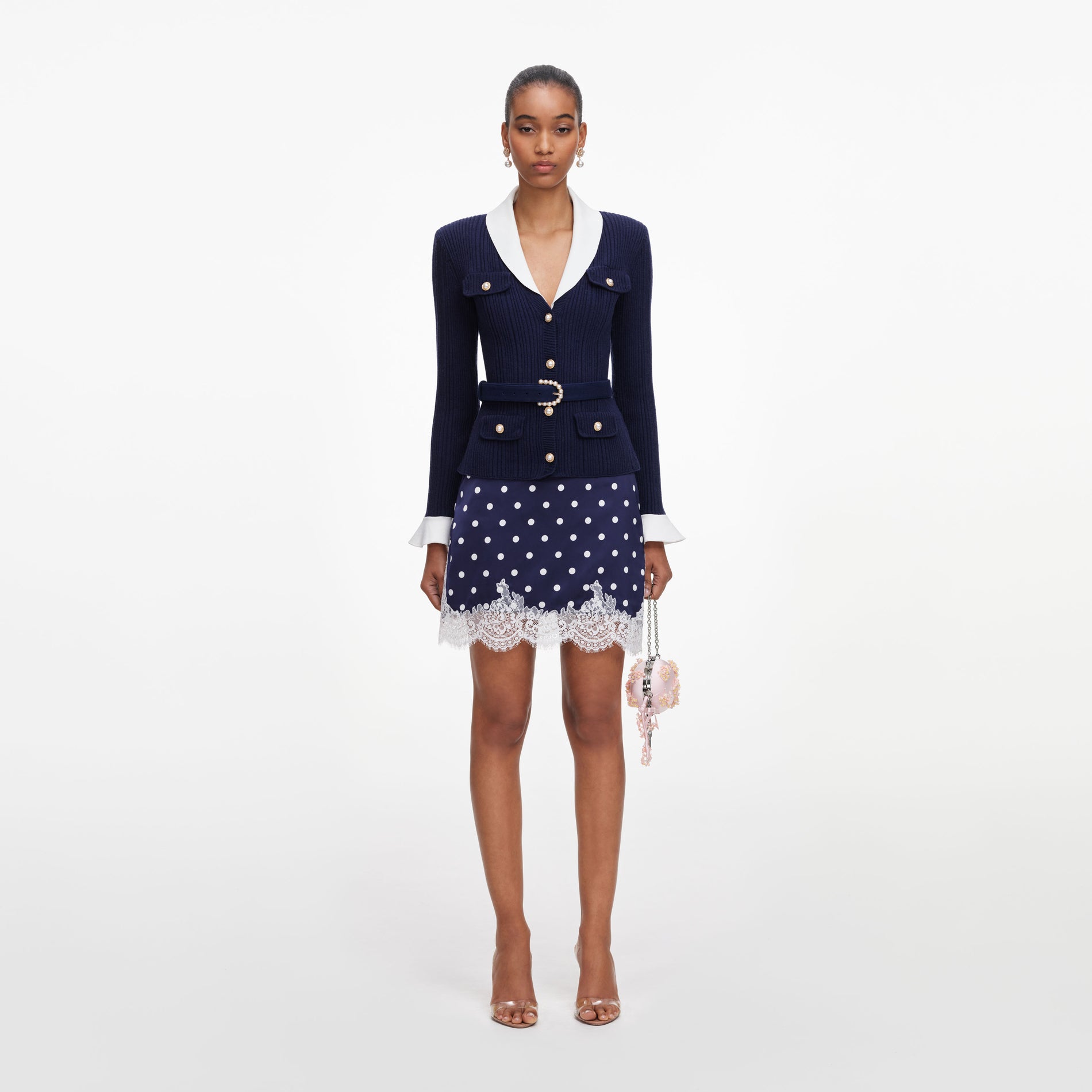 Front view of a woman wearing the Navy Ribbed Knit Cardigan