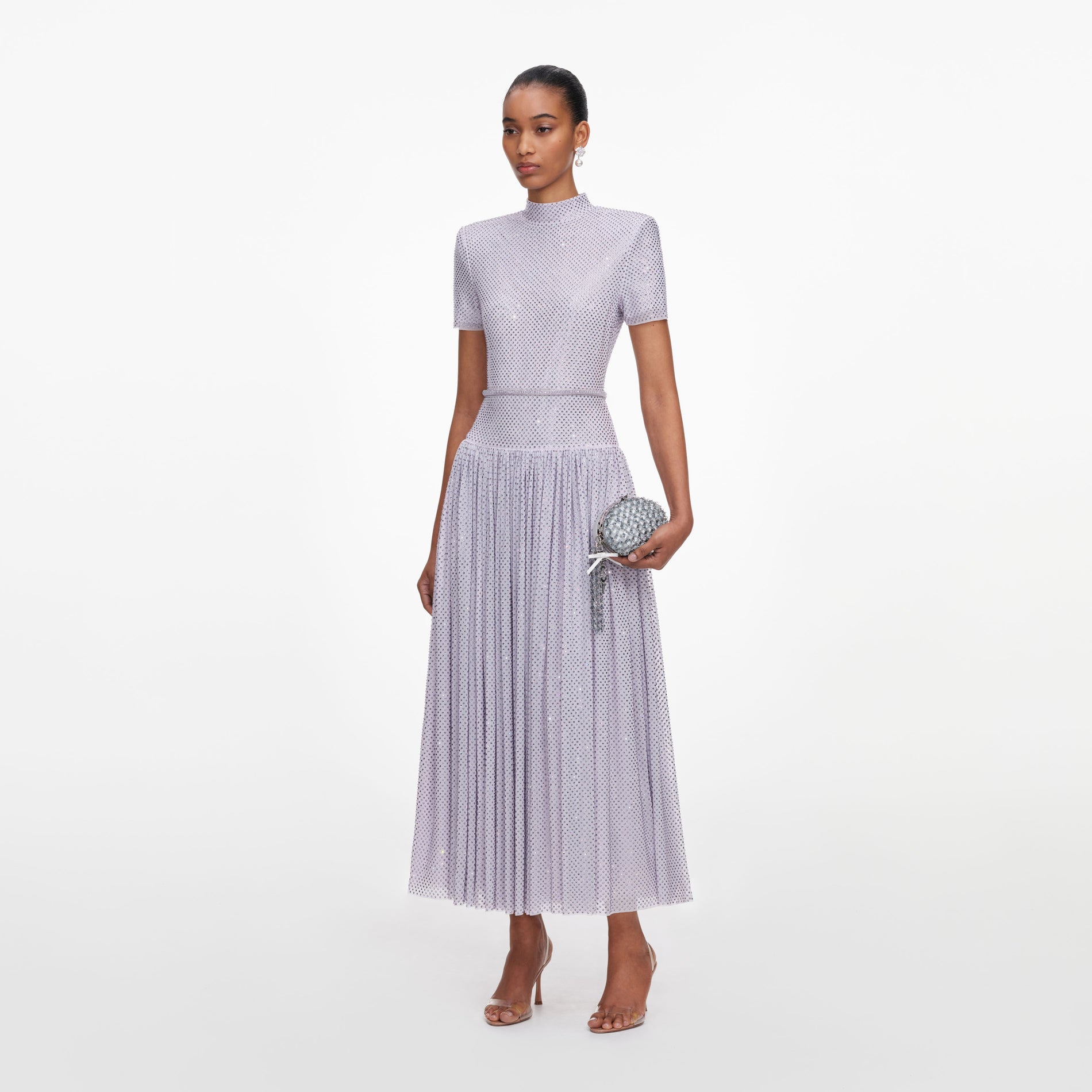 Side view of a woman wearing the Lilac Rhinestone Midi Dress