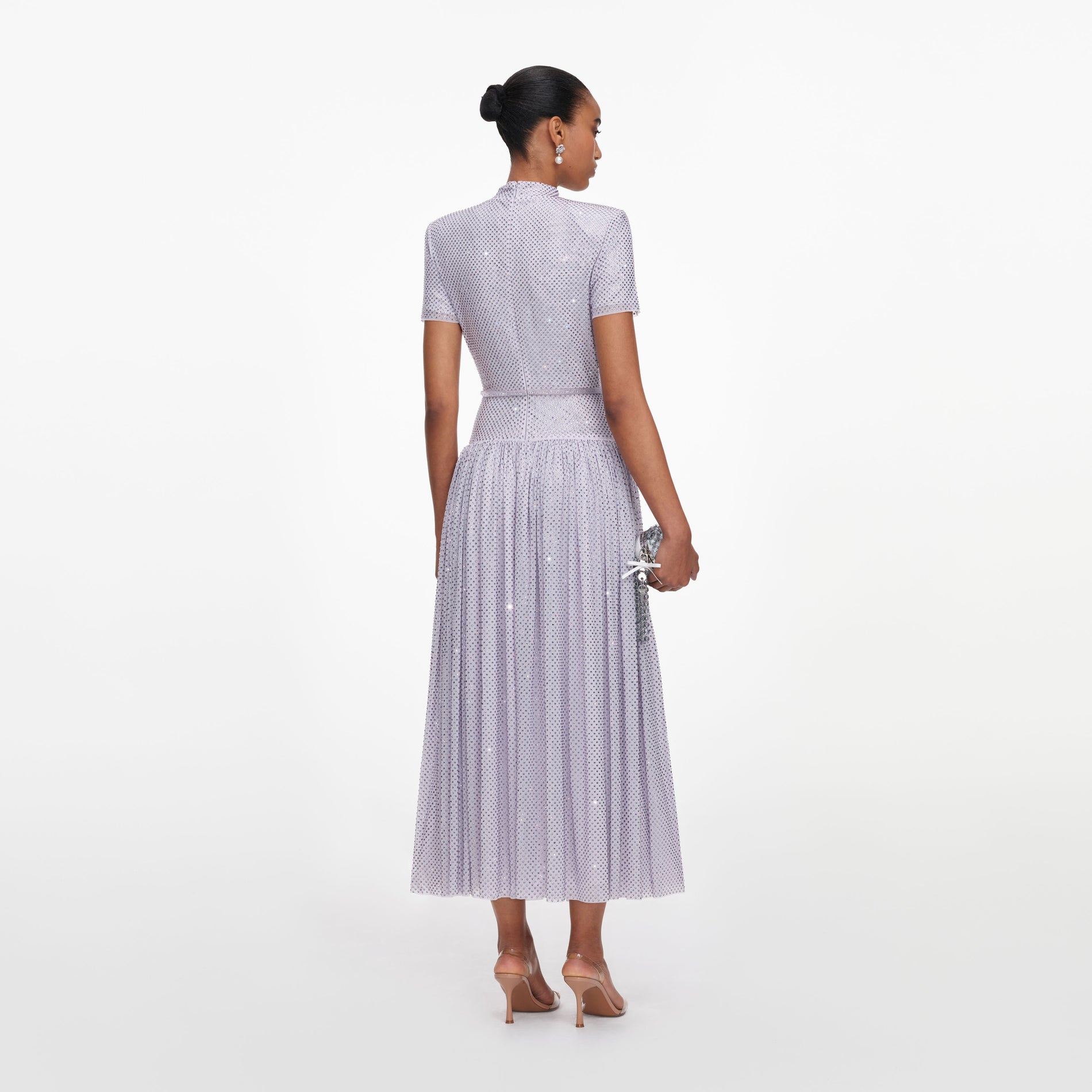 Back view of a woman wearing the Lilac Rhinestone Midi Dress