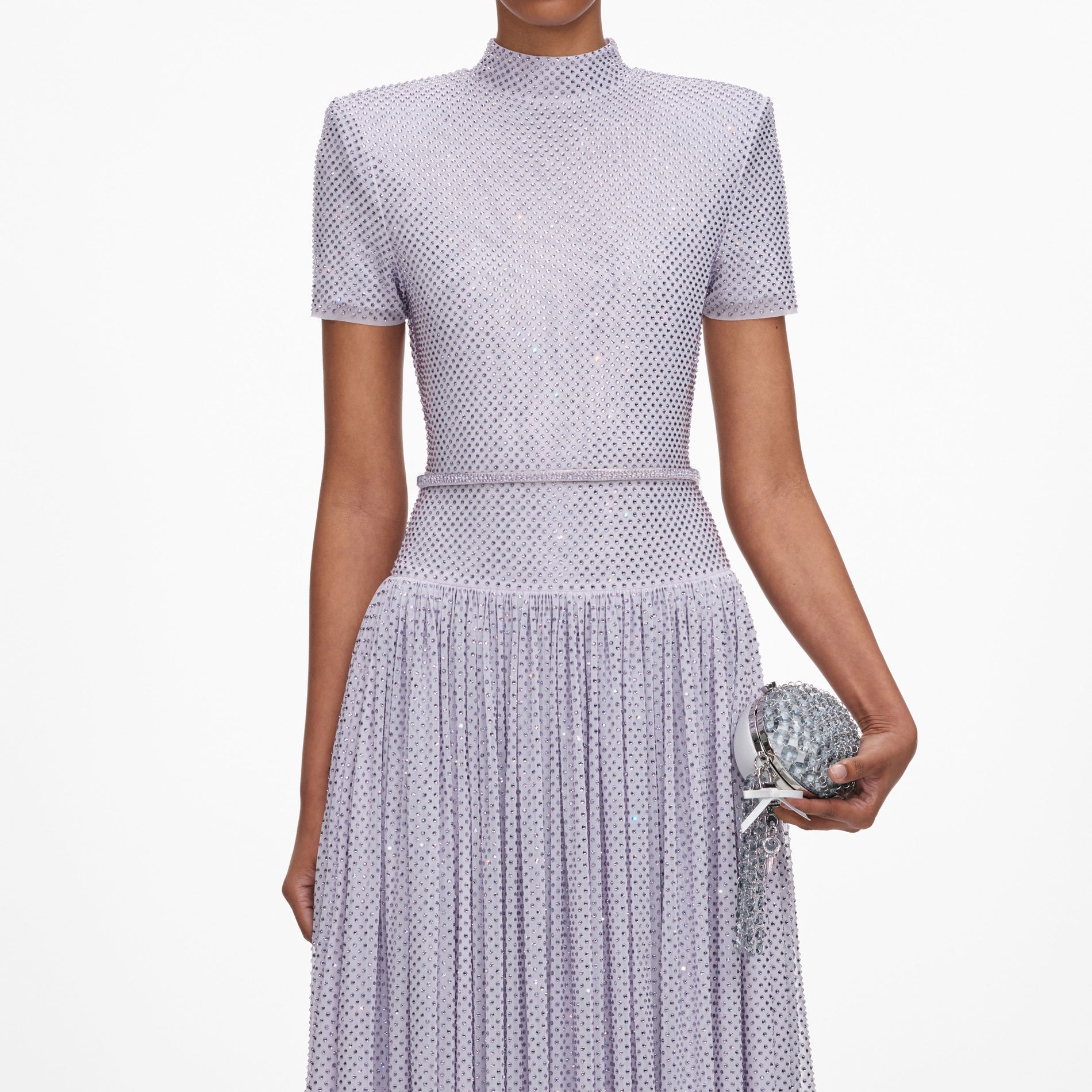 A close up of a woman wearing the Lilac Rhinestone Midi Dress