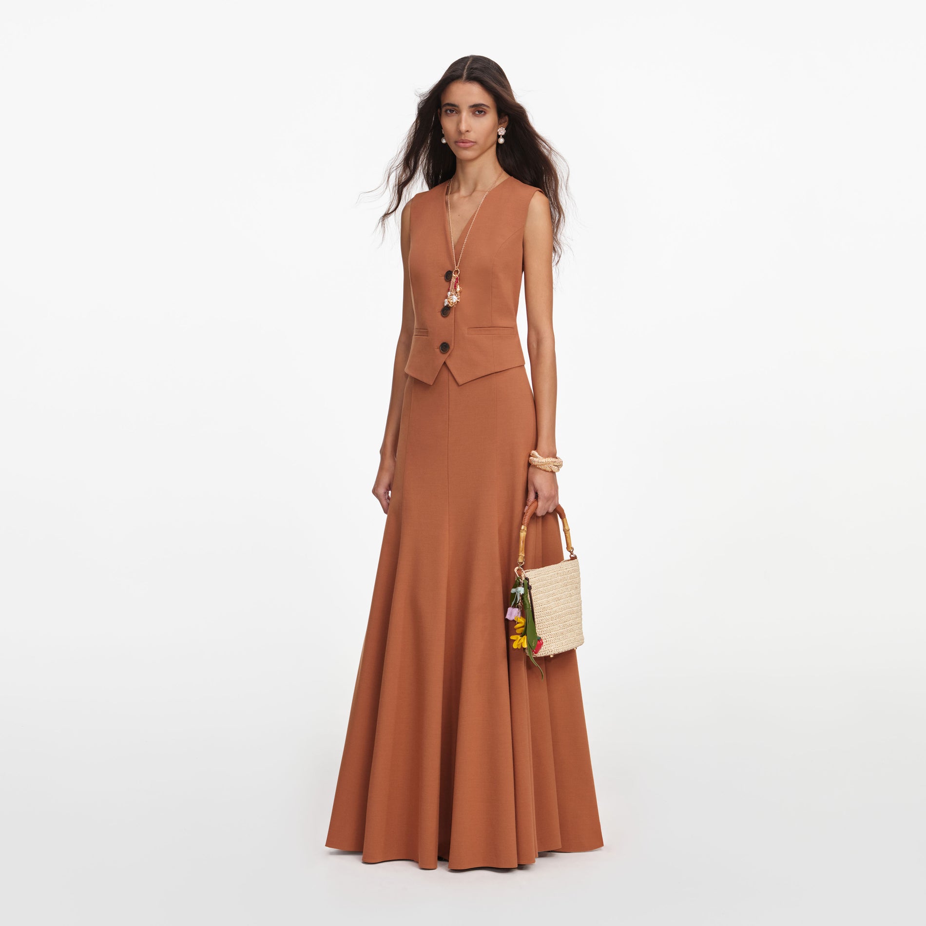 Side view of a woman wearing the Brown Twill Sleeveless Maxi Dress