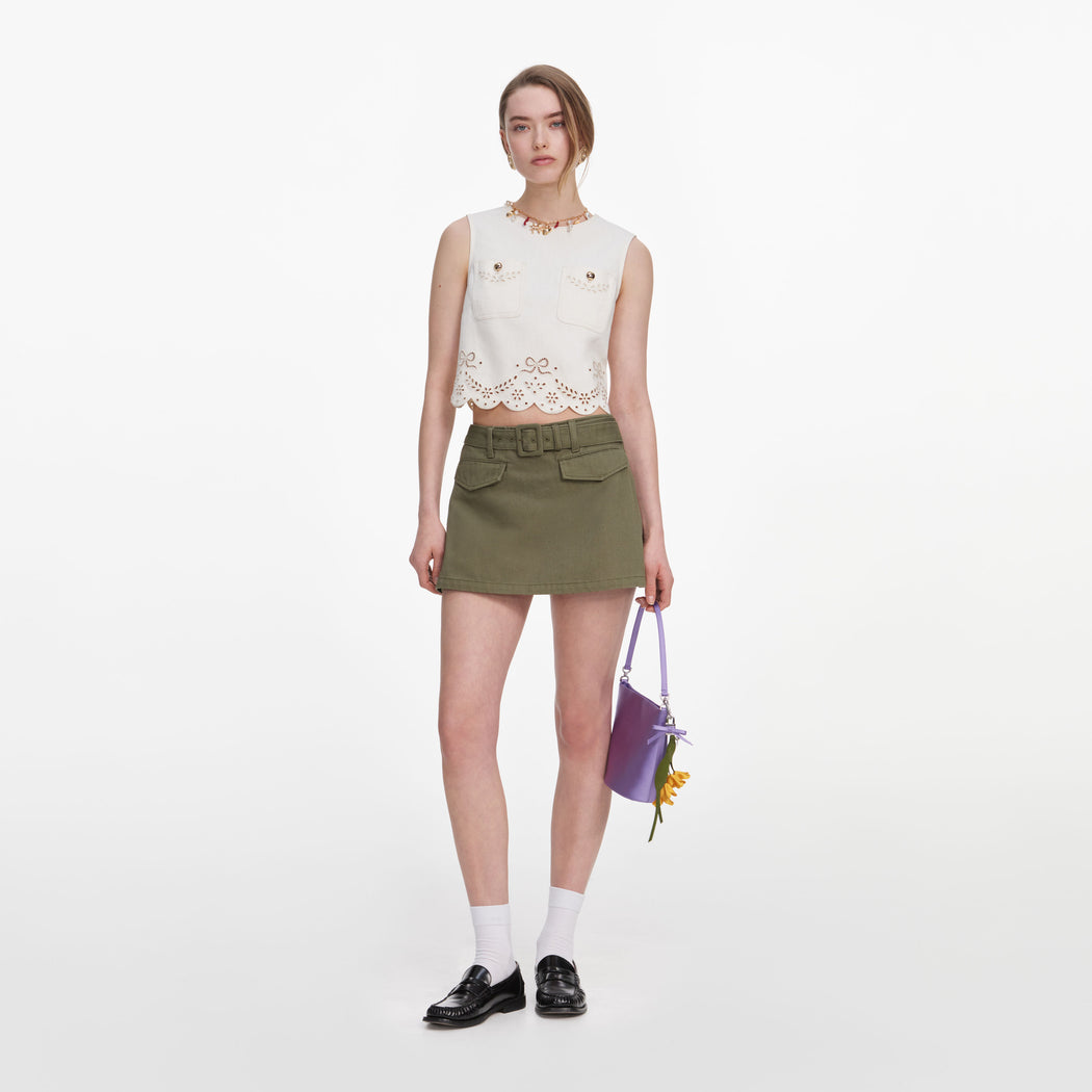 Front view of a woman wearing the Cream Broderie Denim Top