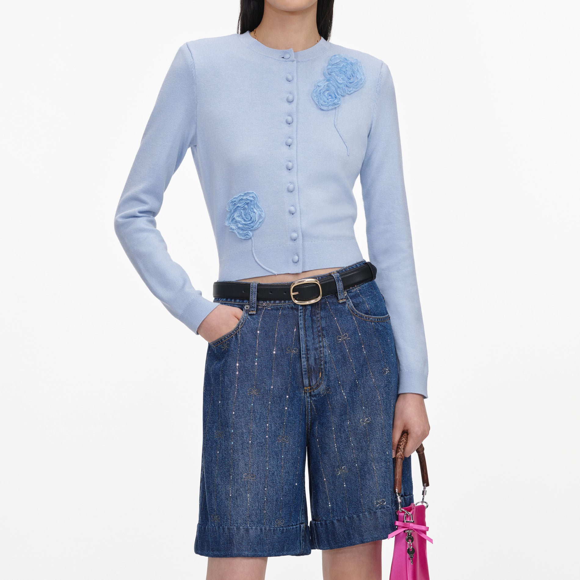 A close up of a woman wearing the Rhinestone Stripe Denim Shorts