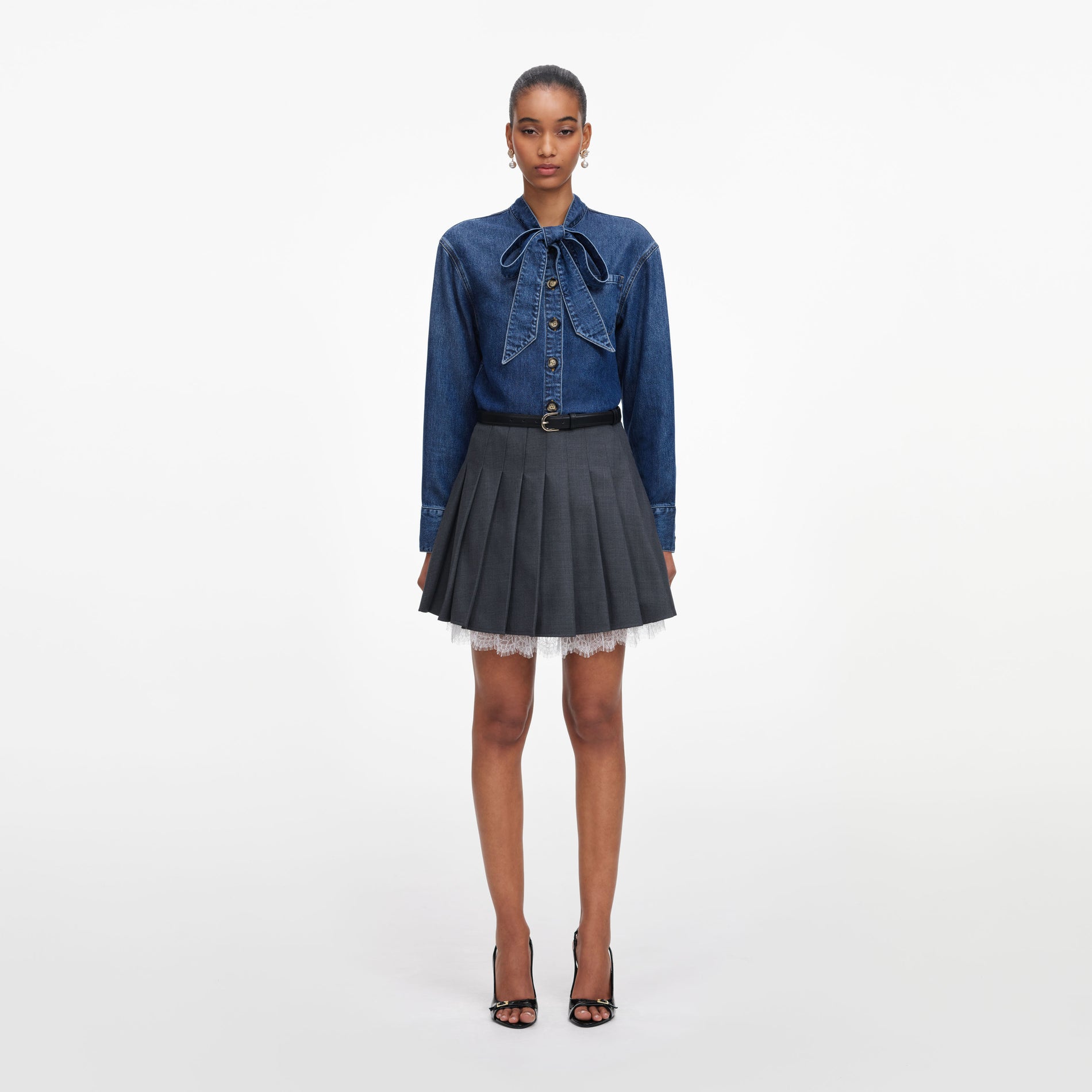 Front view of a woman wearing the Denim Tie Neck Shirt