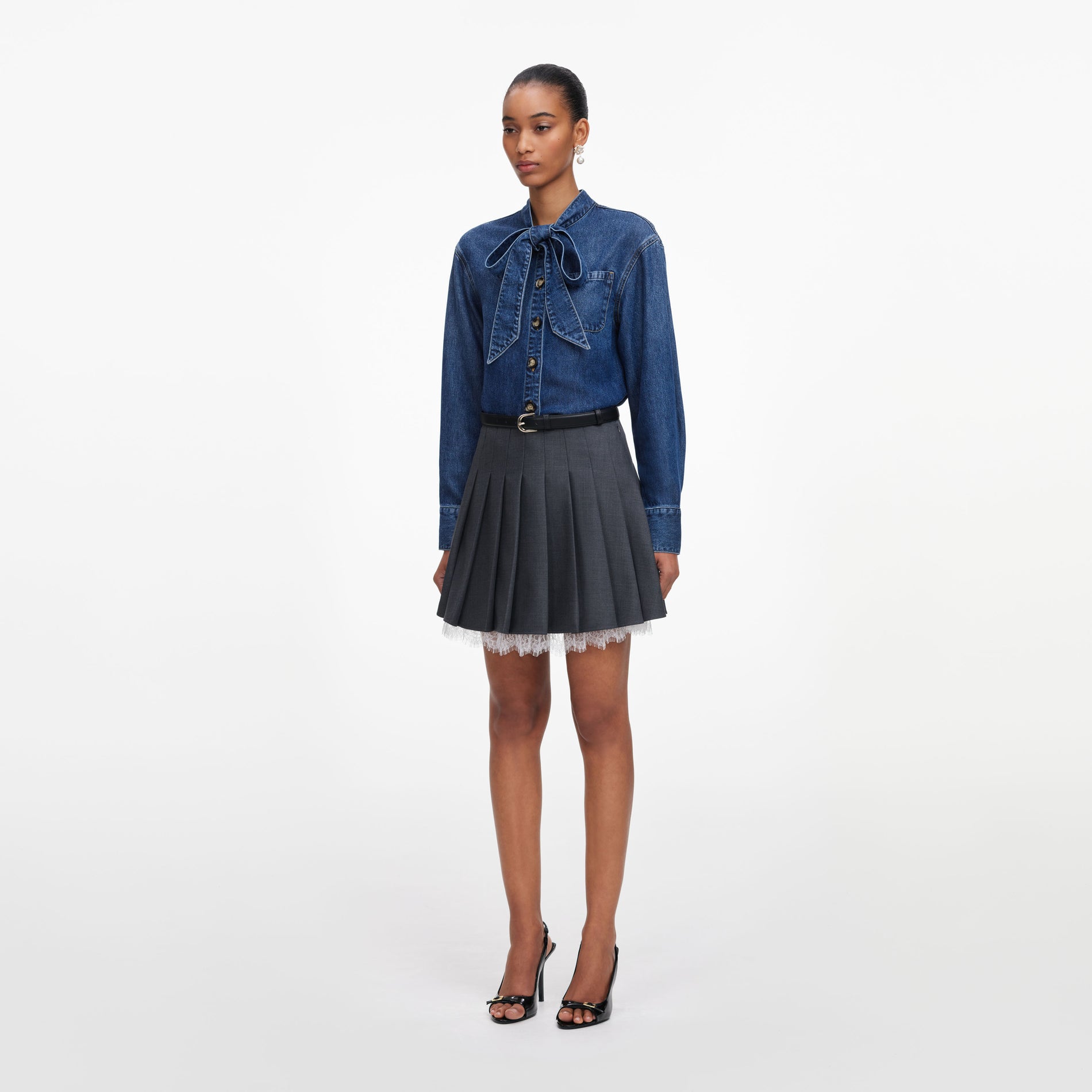 Side view of a woman wearing the Denim Tie Neck Shirt