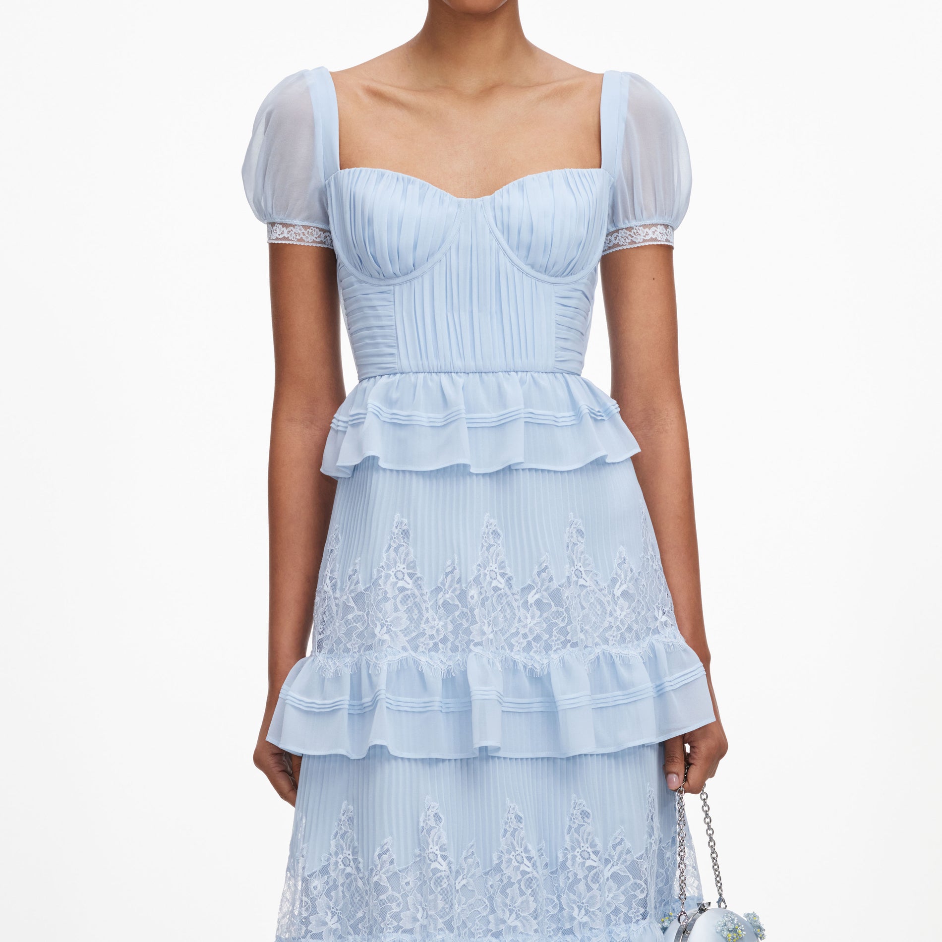 A close up of a woman wearing the Blue Chiffon Short Sleeve Midi Dress