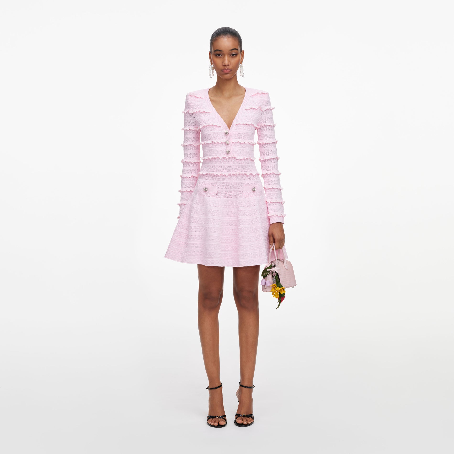 Front view of a woman wearing the Pink Pointelle Diamante Knit Mini Dress