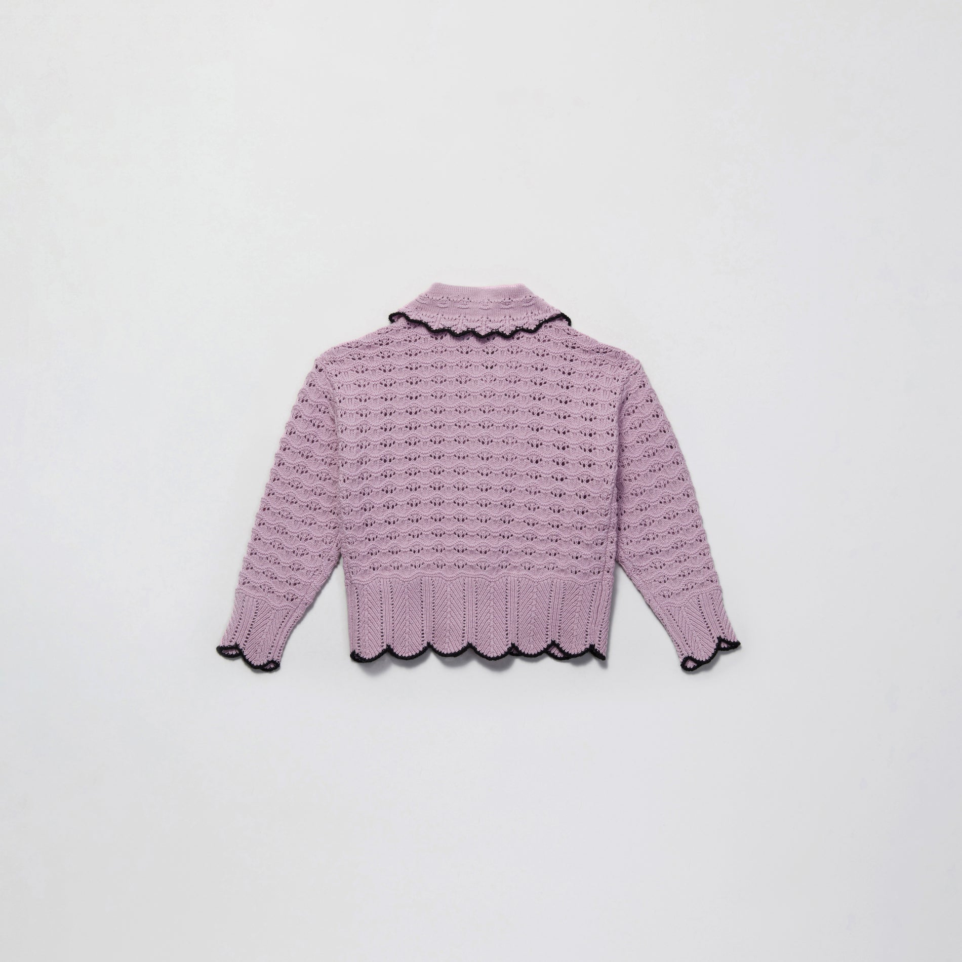 Side view of a woman wearing the Lilac Crochet Knit Cardigan