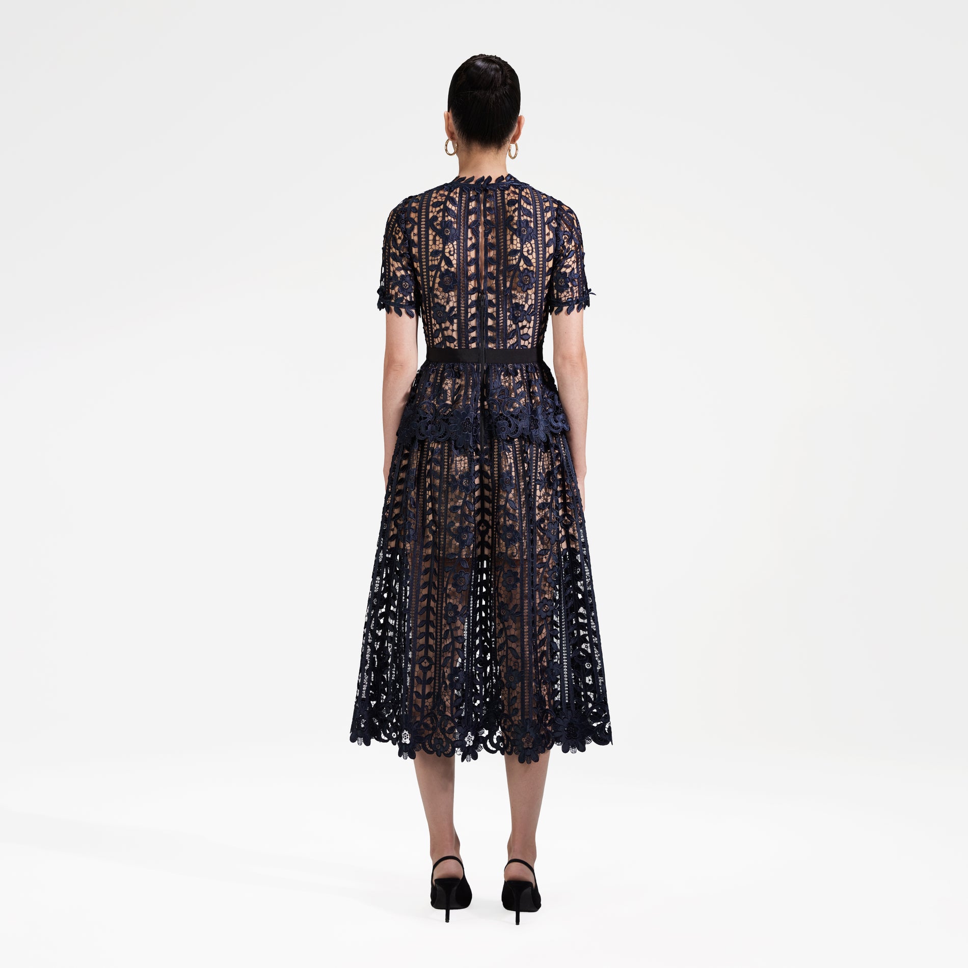 Back view of a woman wearing the Navy Lace Midi Dress