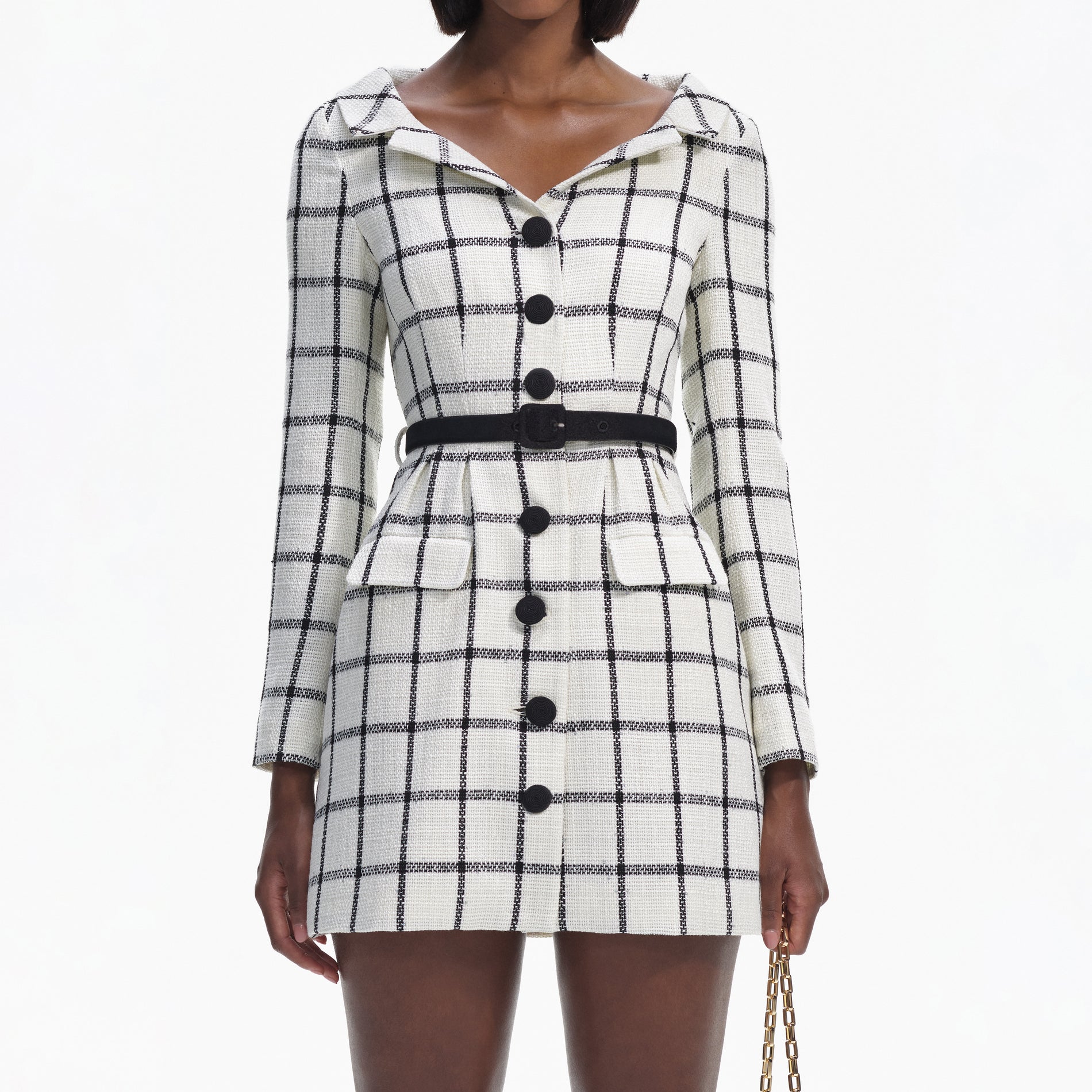 A close up of a woman wearing the Cream Check Tailored Mini Dress