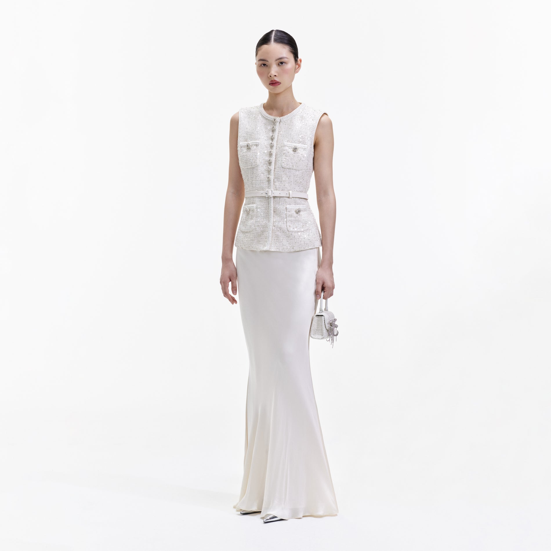 Side view of a woman wearing the Cream Sequin Boucle Maxi Dress