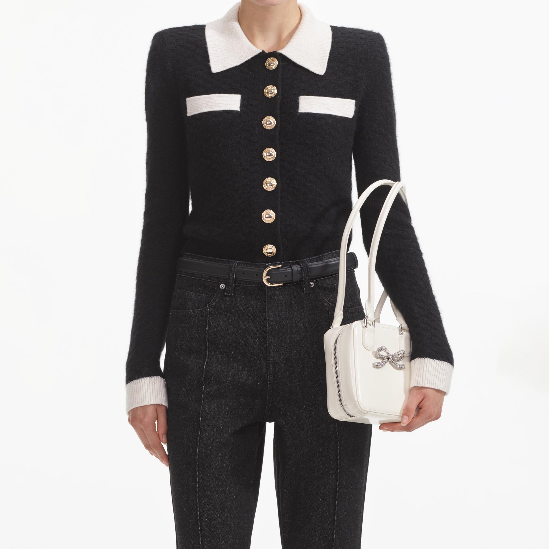 A close up of a woman wearing the Black Textured Cardigan