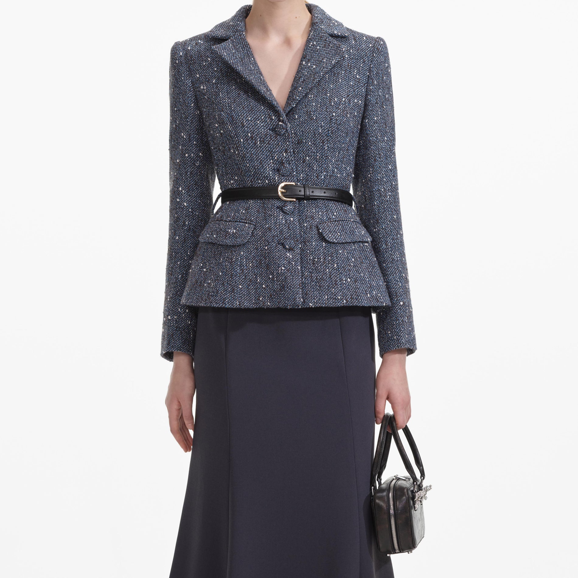 A close up of a woman wearing the Blue Boucle Midi Dress