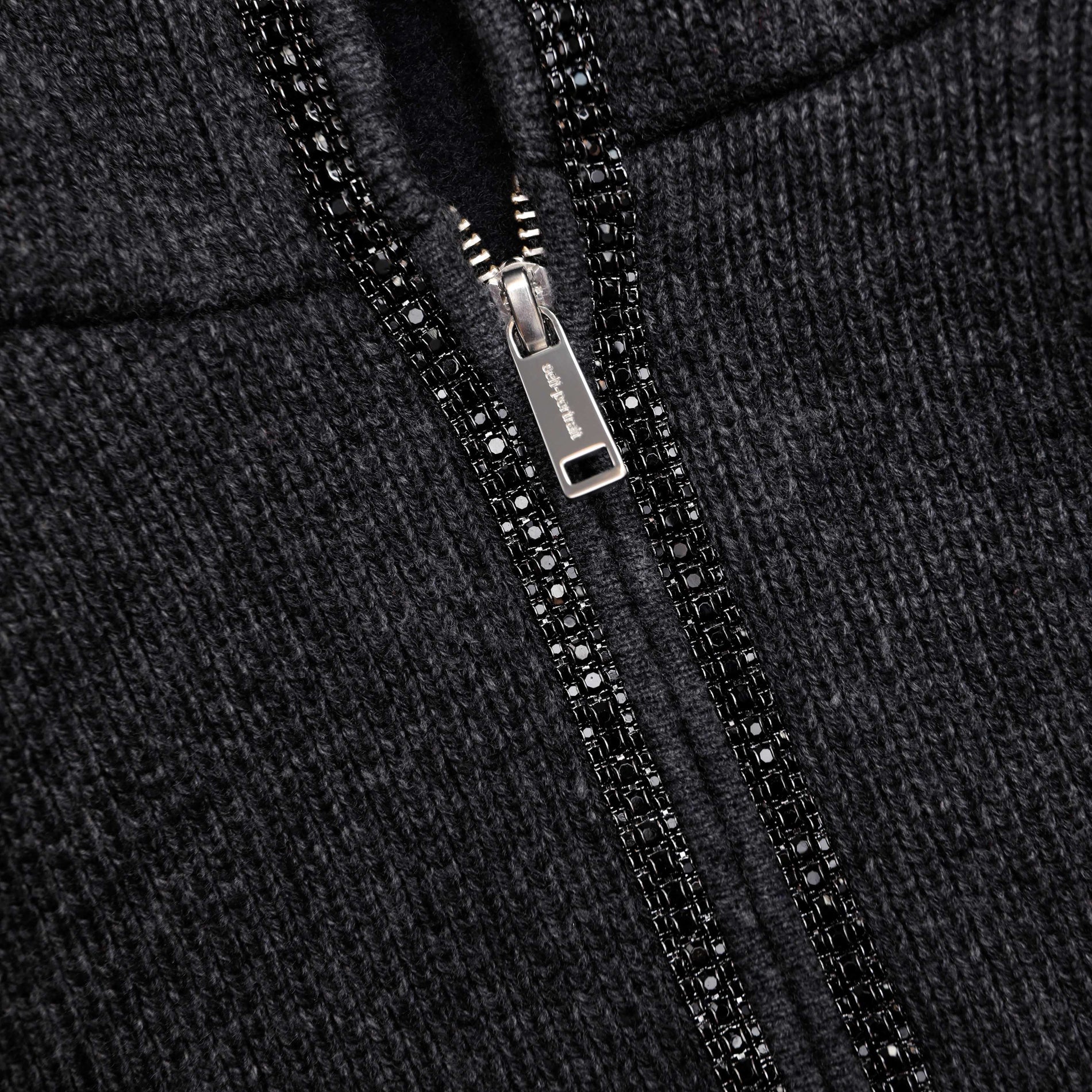 A close up of the fabric for the Grey Knit Cropped Hoodie