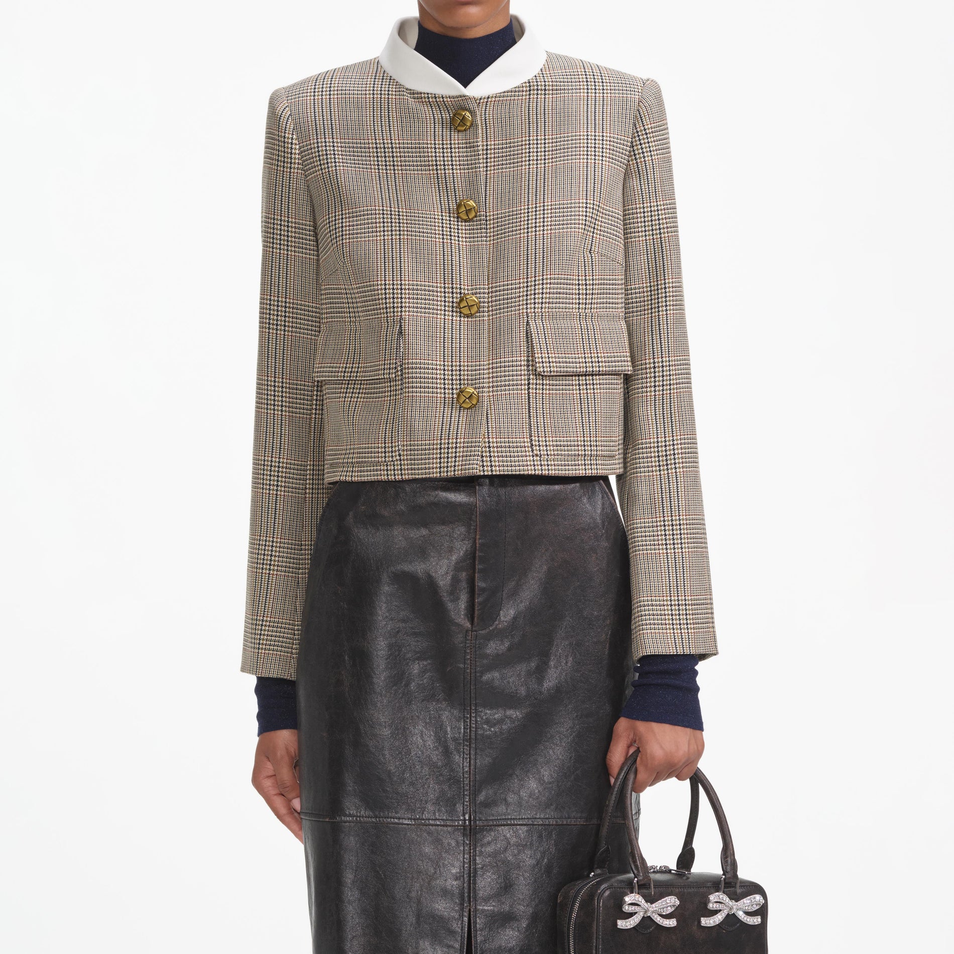 A close up of a woman wearing the Check Wool Jacket